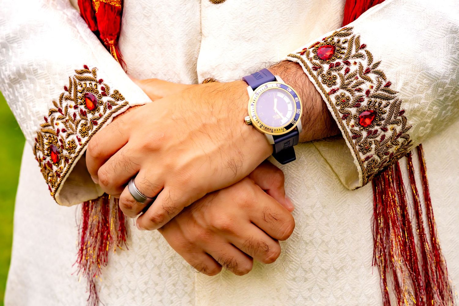 Close-up detail shots of hands adorned with delicate henna designs and jewelry at an Indian wedding ceremony. | PHL, PA Wedding