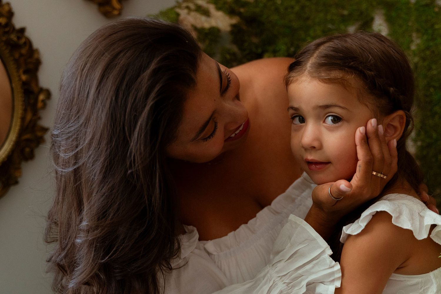 Intimate couple portraits capturing tender moments and romantic embraces in warm sunlit outdoor settings.
