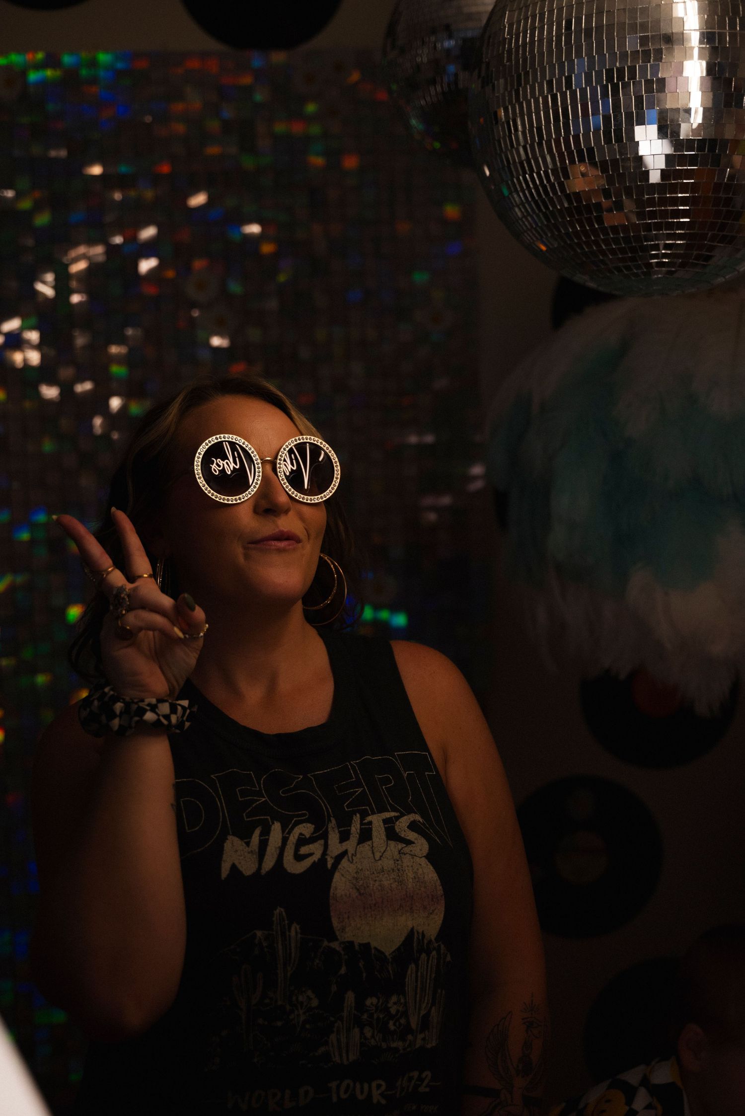 A series of dark nightclub photos with disco balls and retro sunglasses creating a moody party atmosphere.