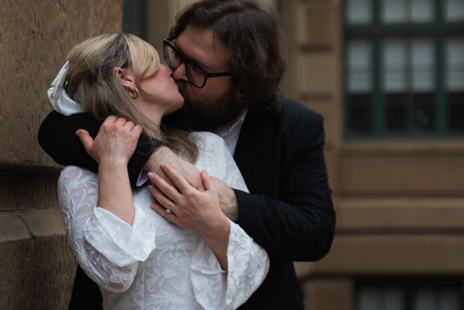 A couple in vintage-style clothing share a passionate kiss in a romantic scene with multiple angles.