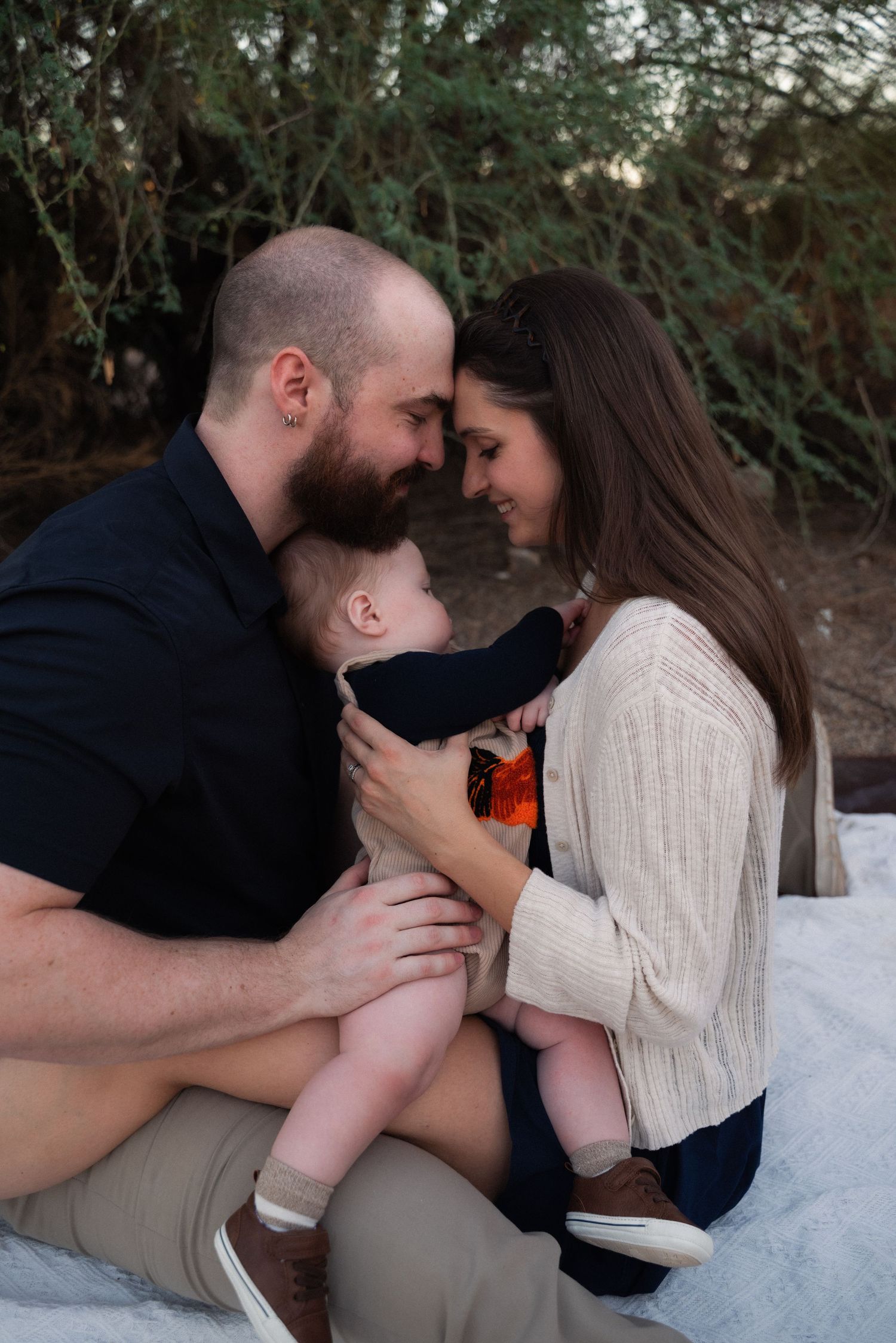 A romantic couple sharing intimate moments together in a series of outdoor photos against a natural backdrop.