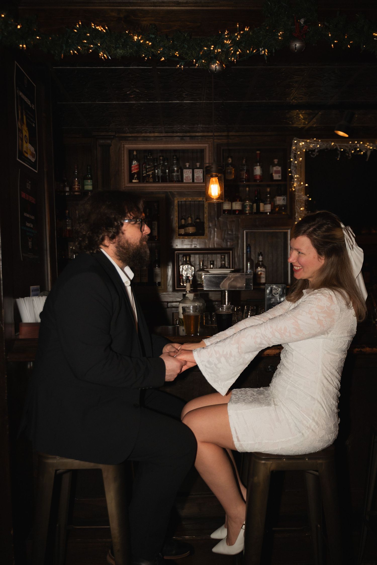 A playful sequence shows a couple at a bar, with one person tipping backwards off a barstool in a humorous moment.