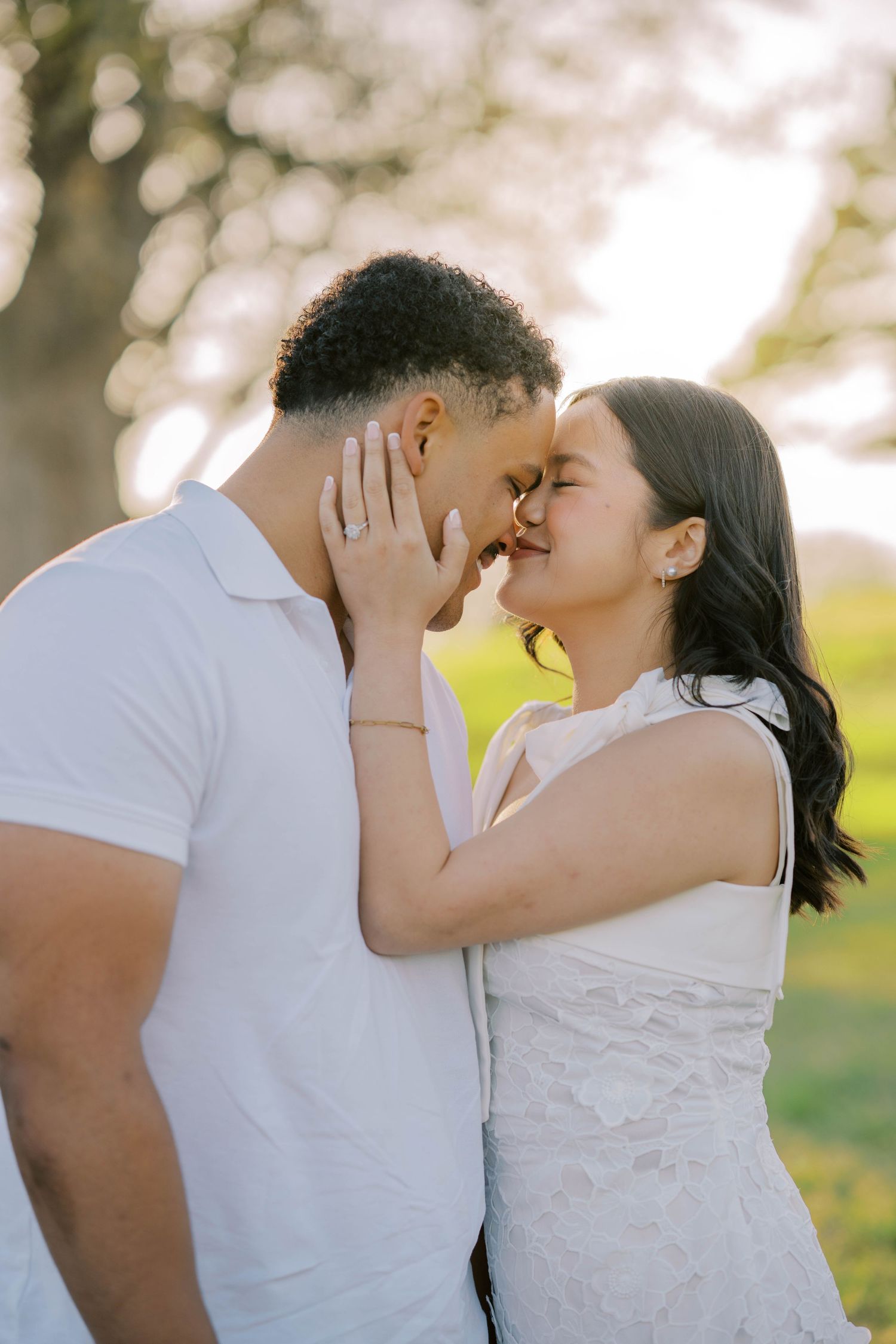 Engaged couple sharing an intimate forehead touch during golden hour at an outdoor Oklahoma engagement session.