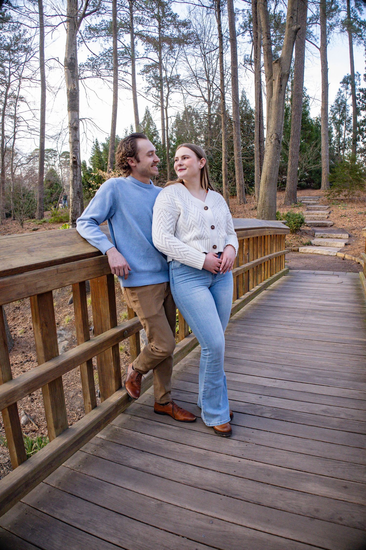 Series of playful moments captured on a wooden boardwalk surrounded by pine trees.