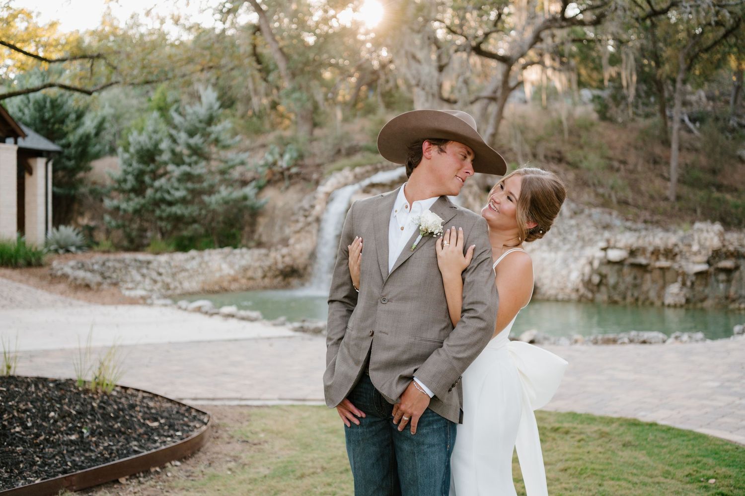 Romantic outdoor wedding photography session with couple in rustic natural setting.