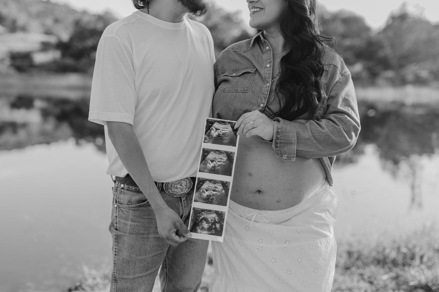 Black and white maternity photos featuring ultrasound pictures and joyful expecting parents.