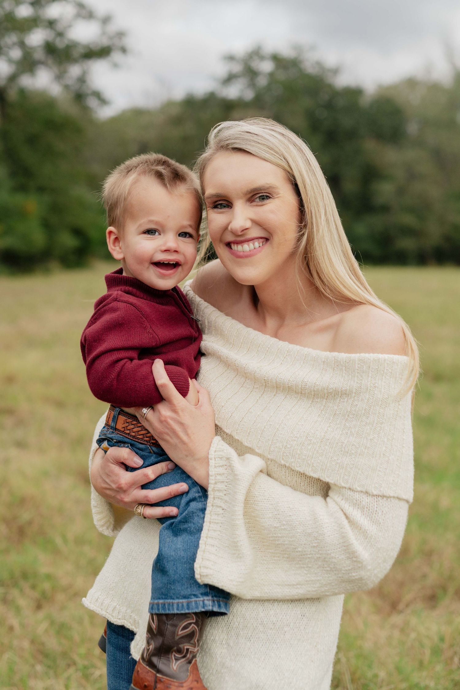 A sweet candid moment between parent and child outdoors.