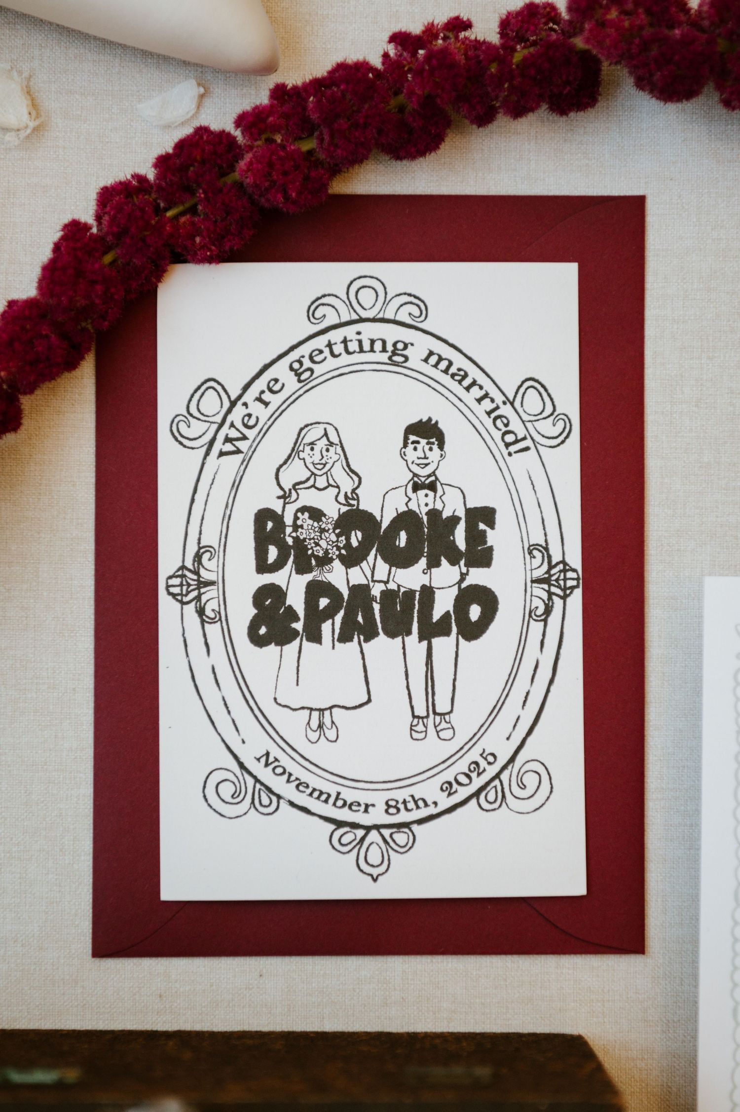 Hand-drawn wedding logo designs featuring a couple in a decorative frame displayed on burgundy and white cards.