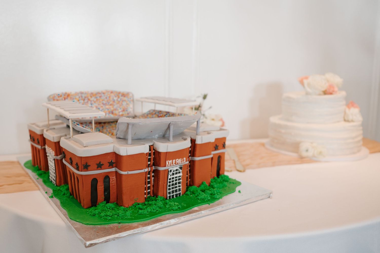 A detailed architectural model of a brick building displayed on a white surface.