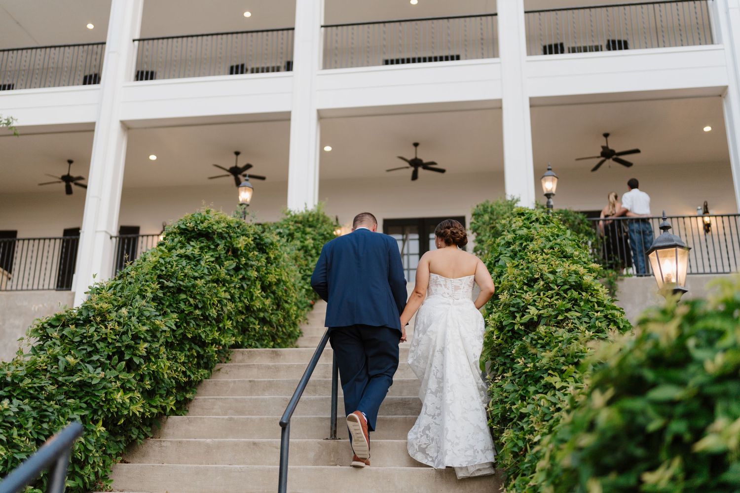 A couple walks up the stairs at Kendall Point in Spring Branch, TX photographed by Alyssa Denson Photography.