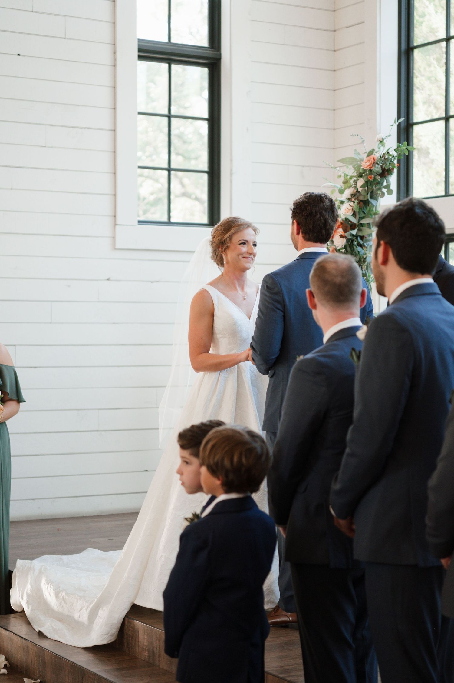 Texas wedding ceremony takes place at Morgan Creek Barn in Dripping Springs photographed by Alyssa Denson Photography, a Texas photographer.
