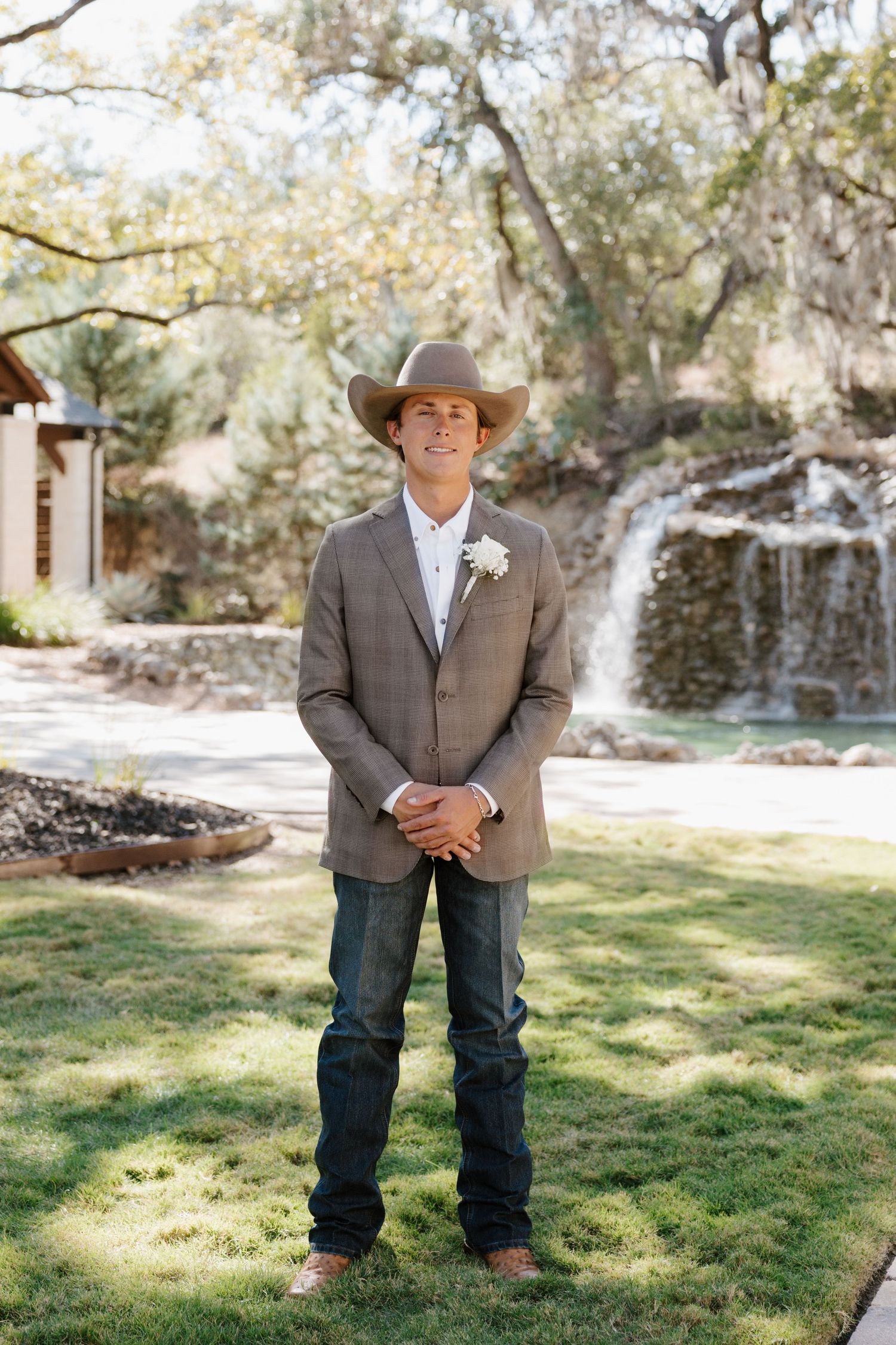 Western-themed wedding photos taken outdoors with rustic scenery and trees.