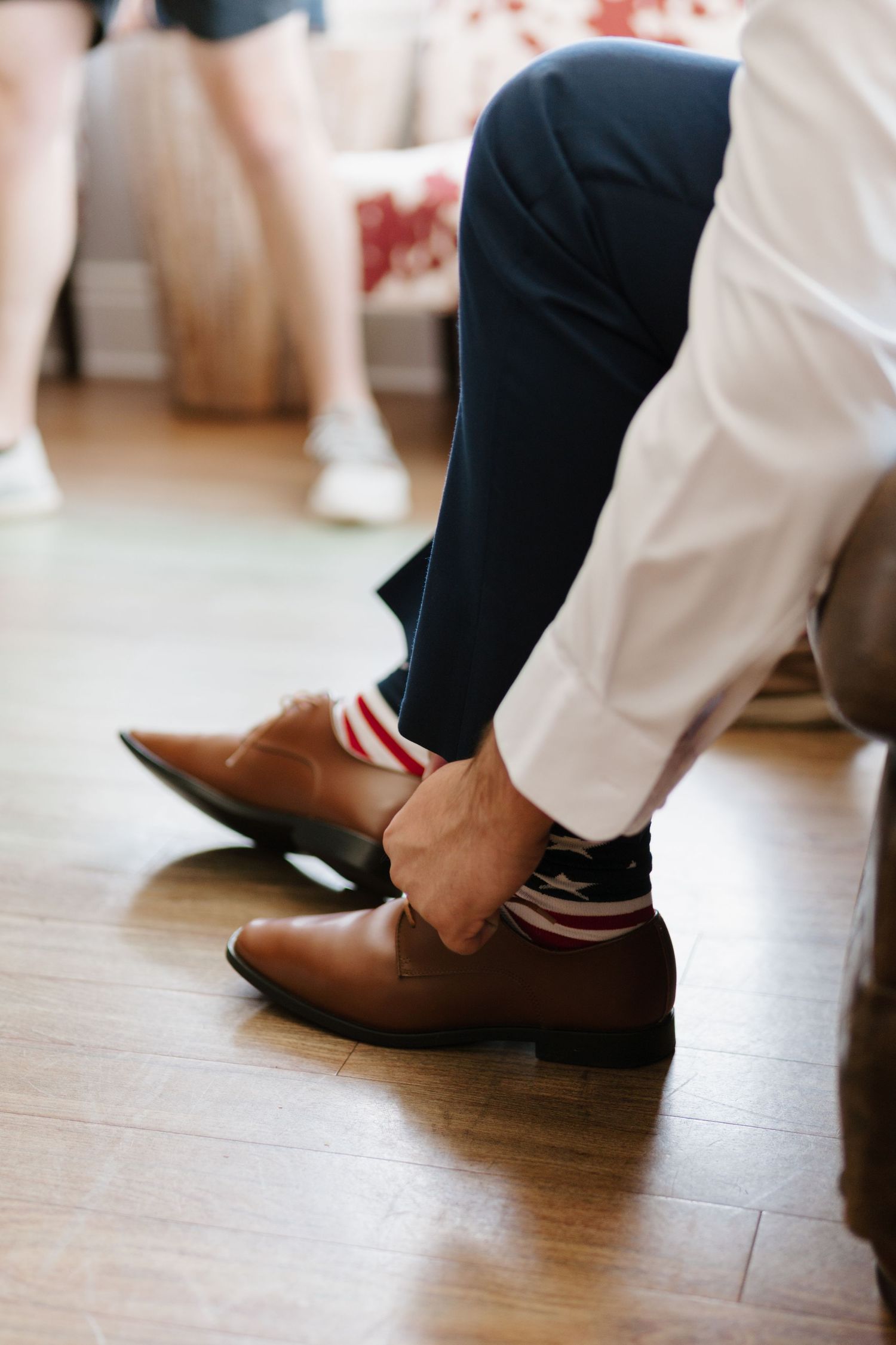 Close-up of dress shoes and socks worn at a formal wedding.