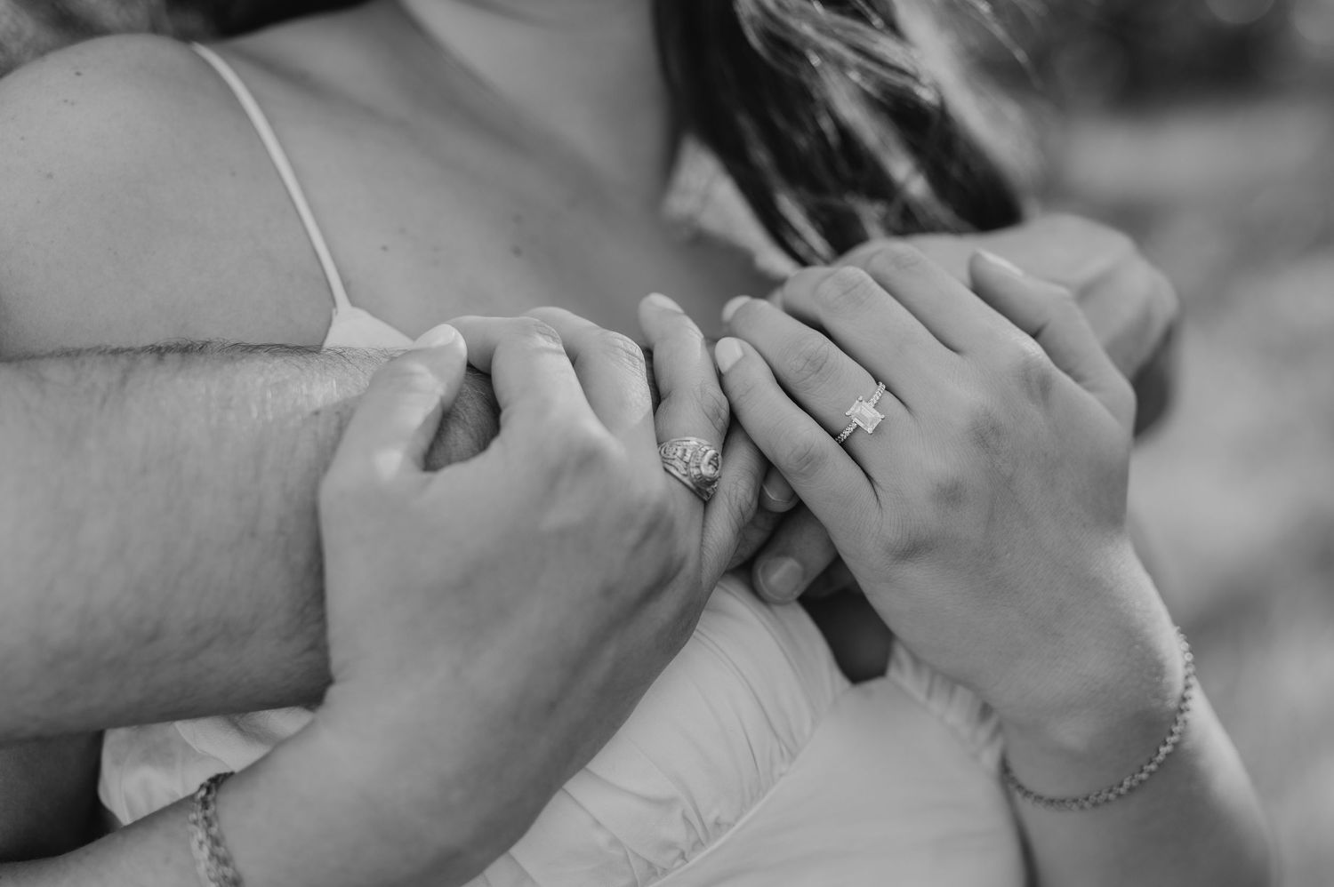 Black and white collage of close-up shots showing emotional expressions and intimate moments between people.