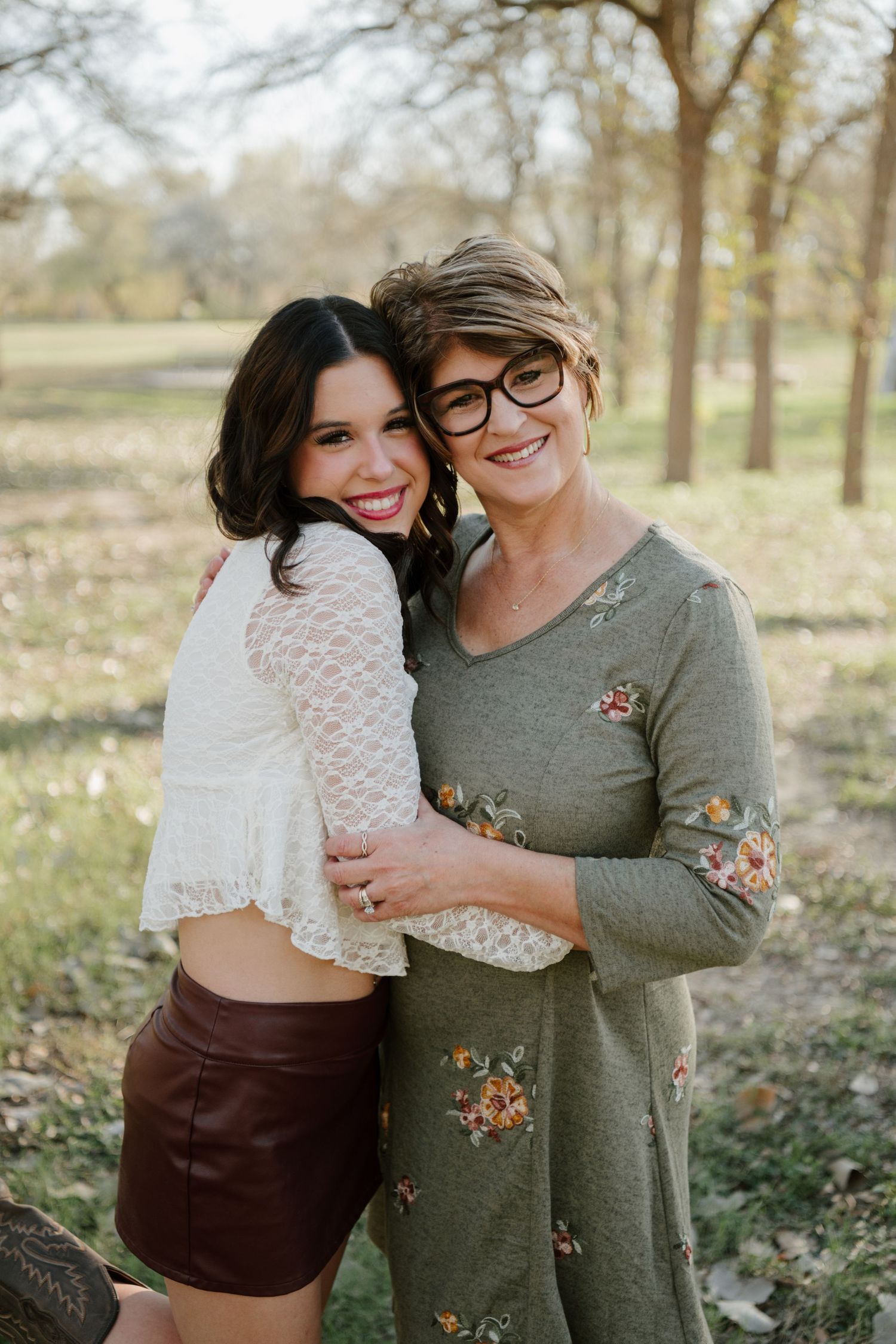 A series of intimate outdoor portrait photos showing two people embracing in a natural setting with trees.
