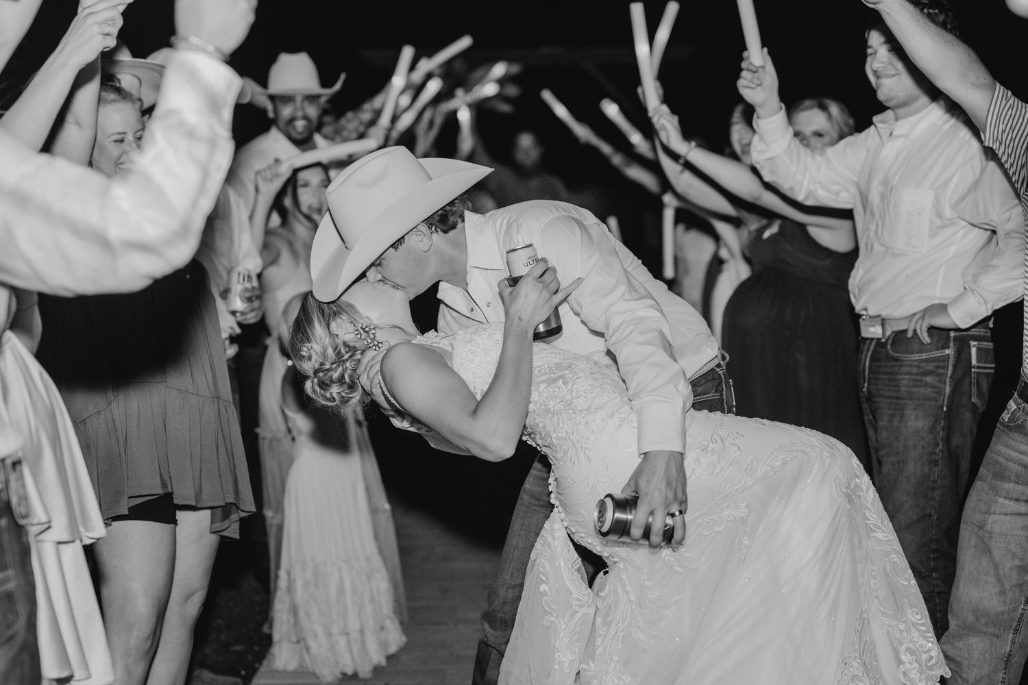 Black and white photo of romantic dance floor moment at wedding reception.