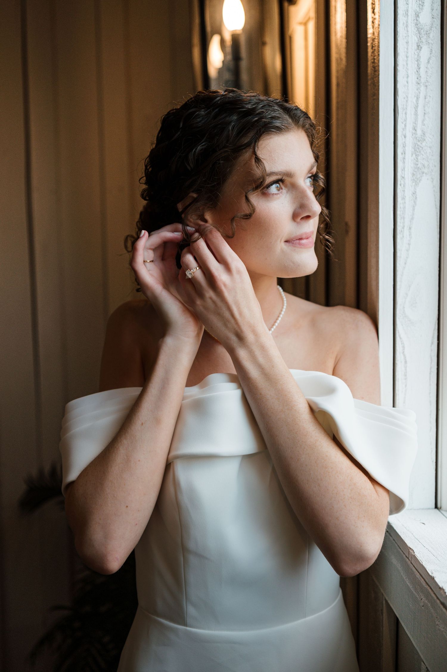 A series of artistic portraits showing someone in a white top looking thoughtfully by a window in warm lighting.
