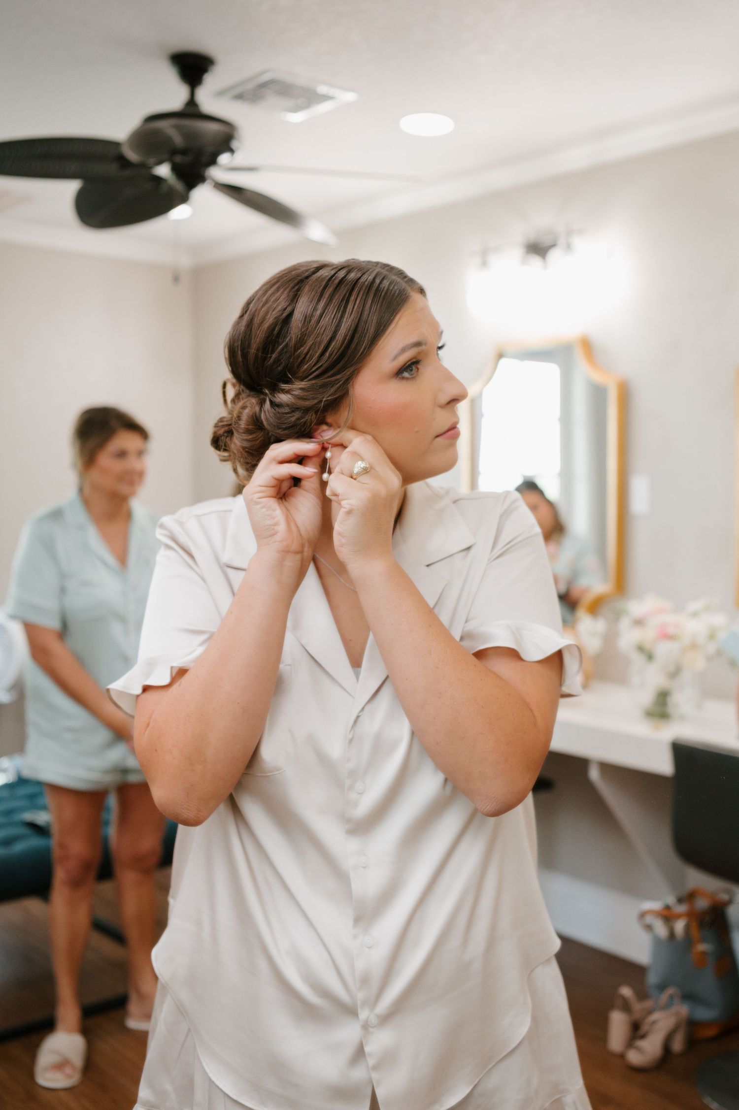 Getting ready for the wedding day with preparations taking place in a bright white dressing room.