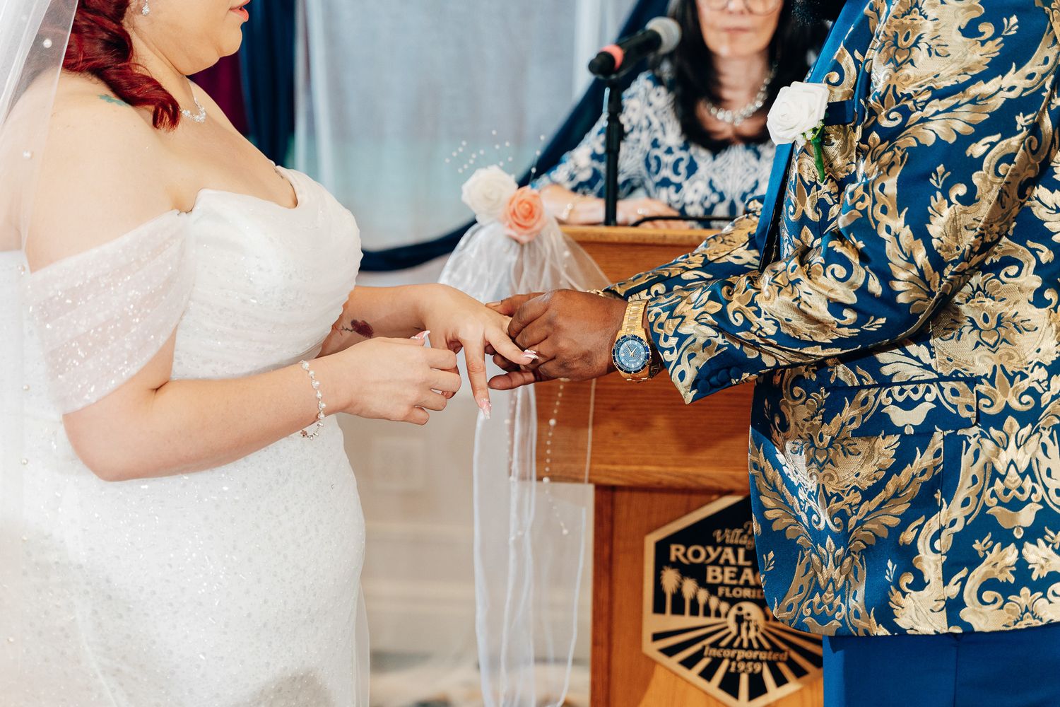 Bride and groom performing a unity ceremony ritual during their wedding.