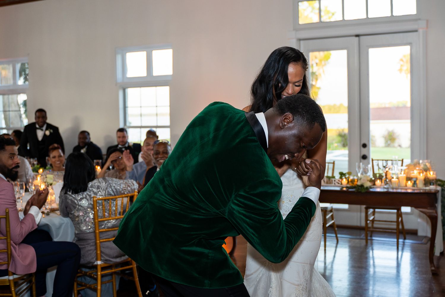 Romantic dance moment between newlyweds during wedding reception.