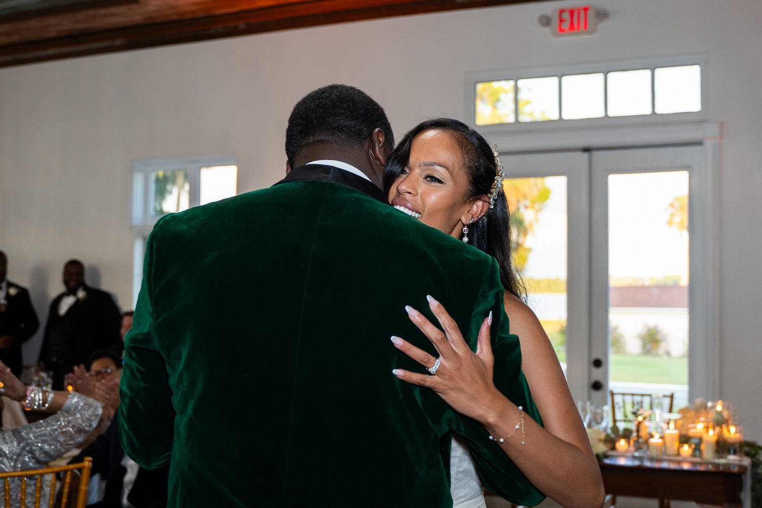 Couple shares intimate dance moment at wedding reception.