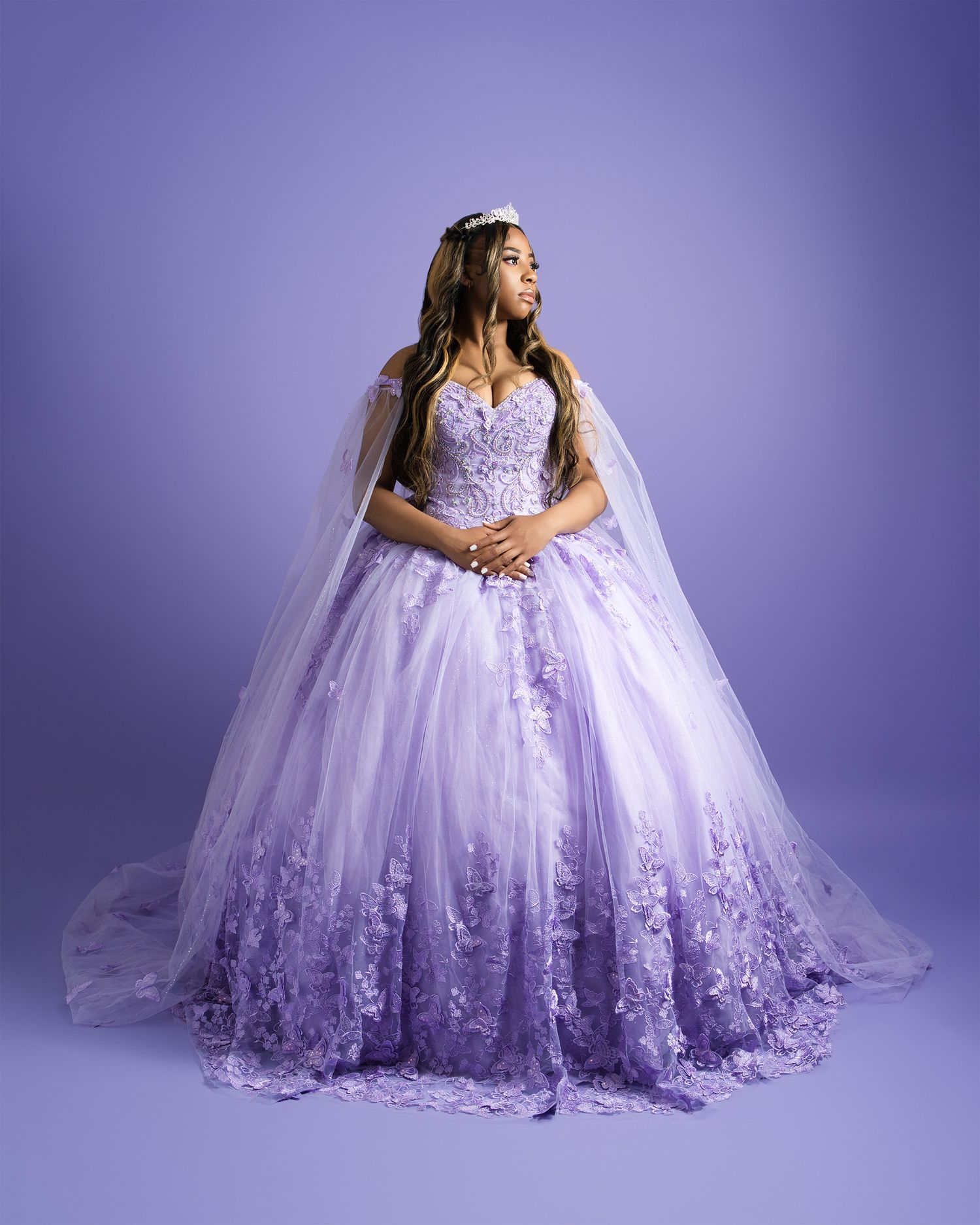 A romantic bridal portrait in a purple ombre ball gown with delicate lace details.
