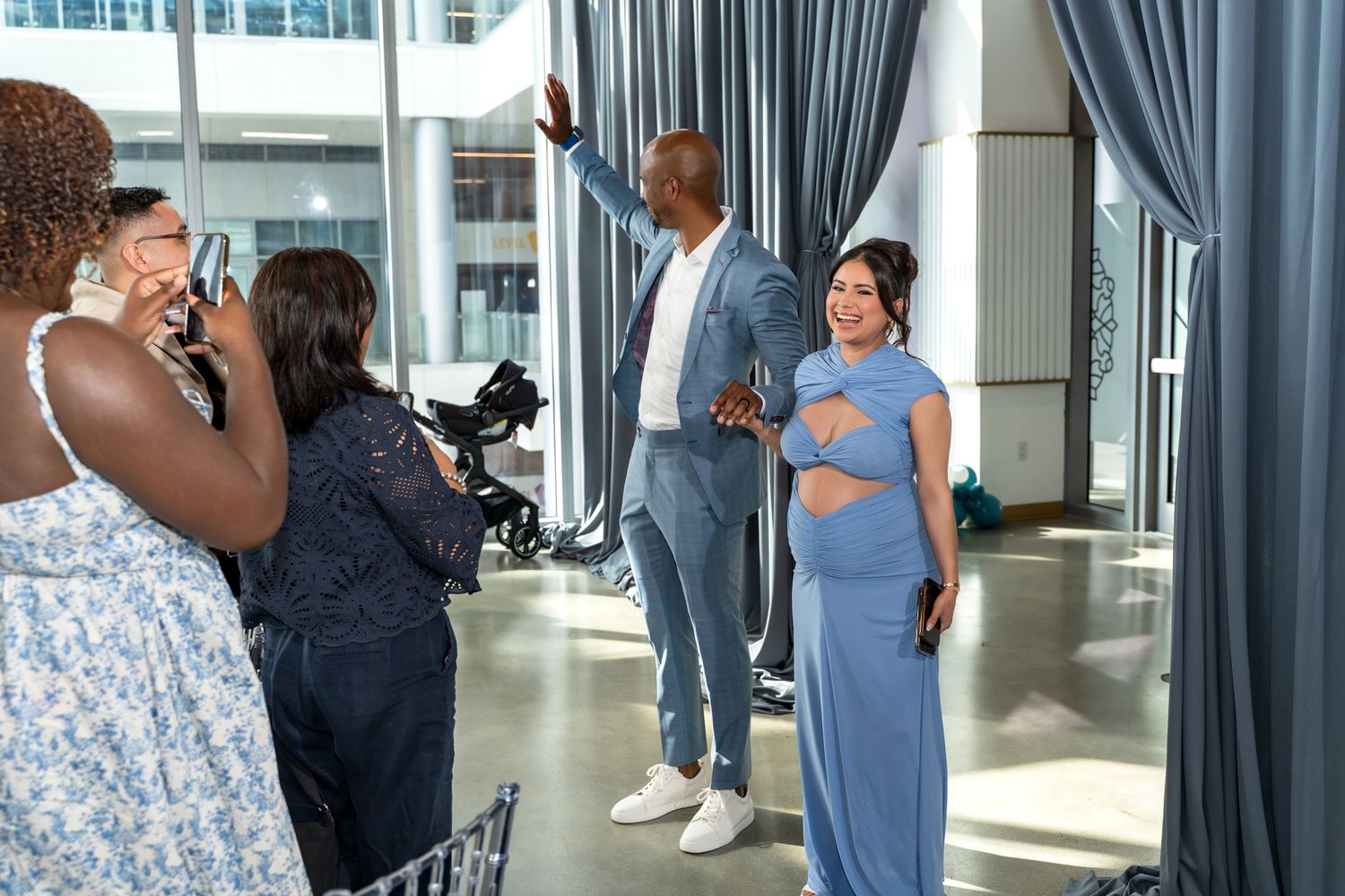 Professional event photography session with a couple posing in formal attire in an elegant venue.