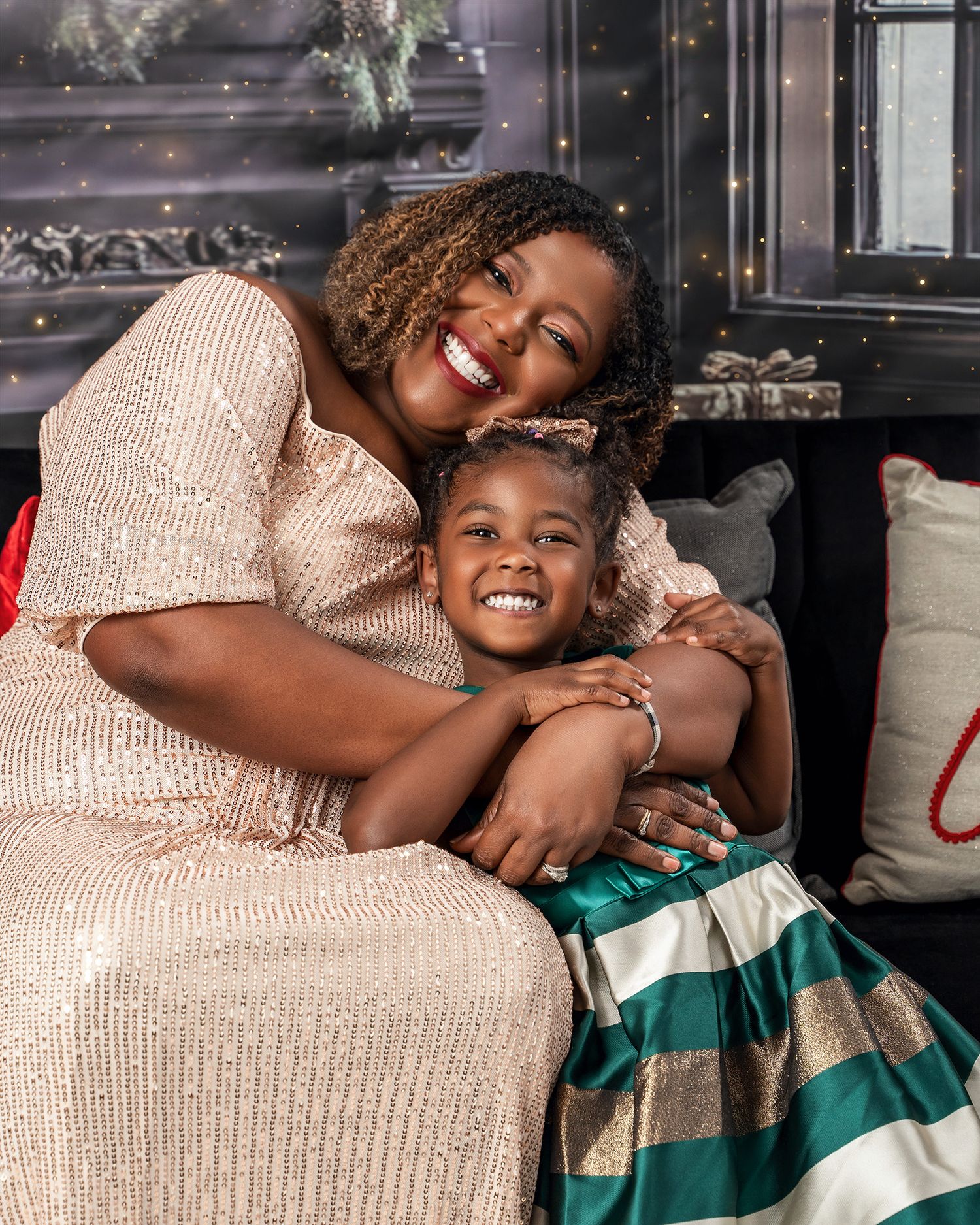 A heartwarming holiday moment captured with sparkly dress and festive Christmas decorations.
