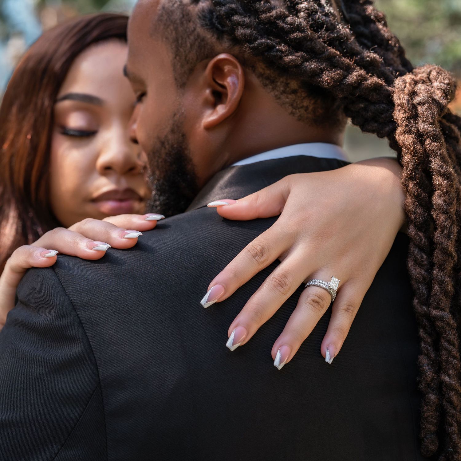 Intimate wedding photo showing tender embrace and gentle moments in close detail.