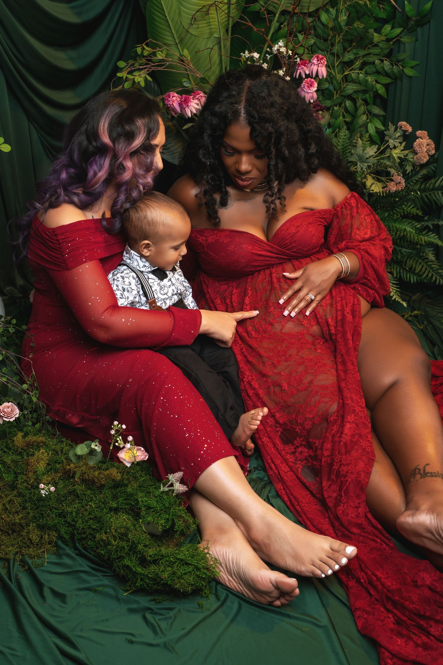 A series of artistic maternity photos showing tender moments in red lace dresses against a dark green backdrop.