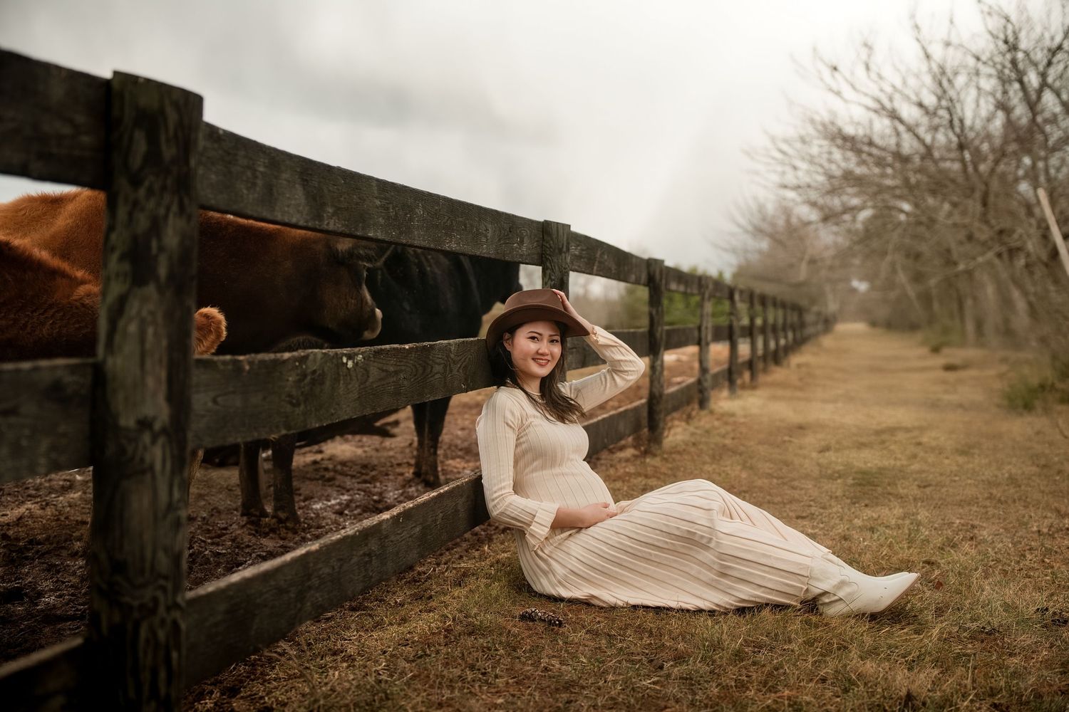 A romantic photo series of a couple in formal attire posing along a rustic wooden fence at sunset.