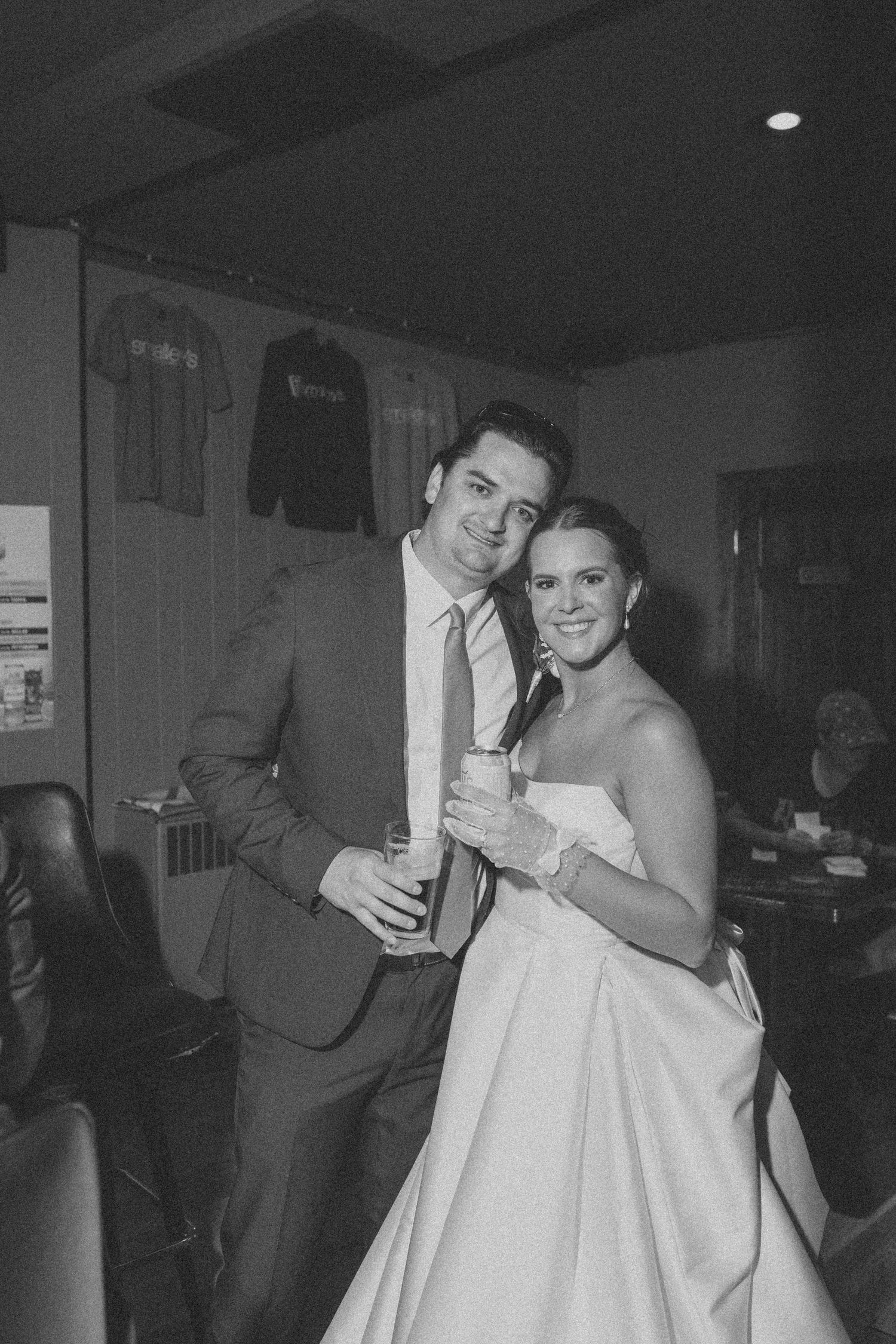 A black and white photo series shows a couple enjoying drinks and dancing together at what appears to be a party or event.