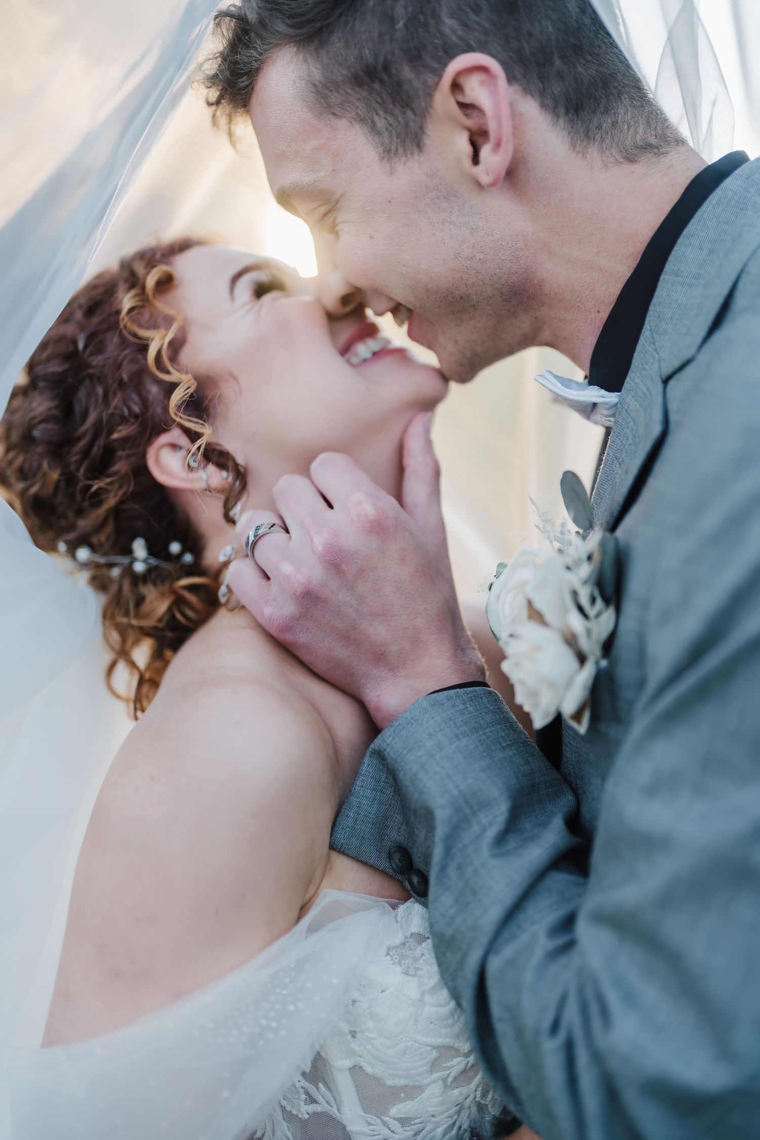 Romantic close-up wedding portrait showing a tender moment between newlyweds.