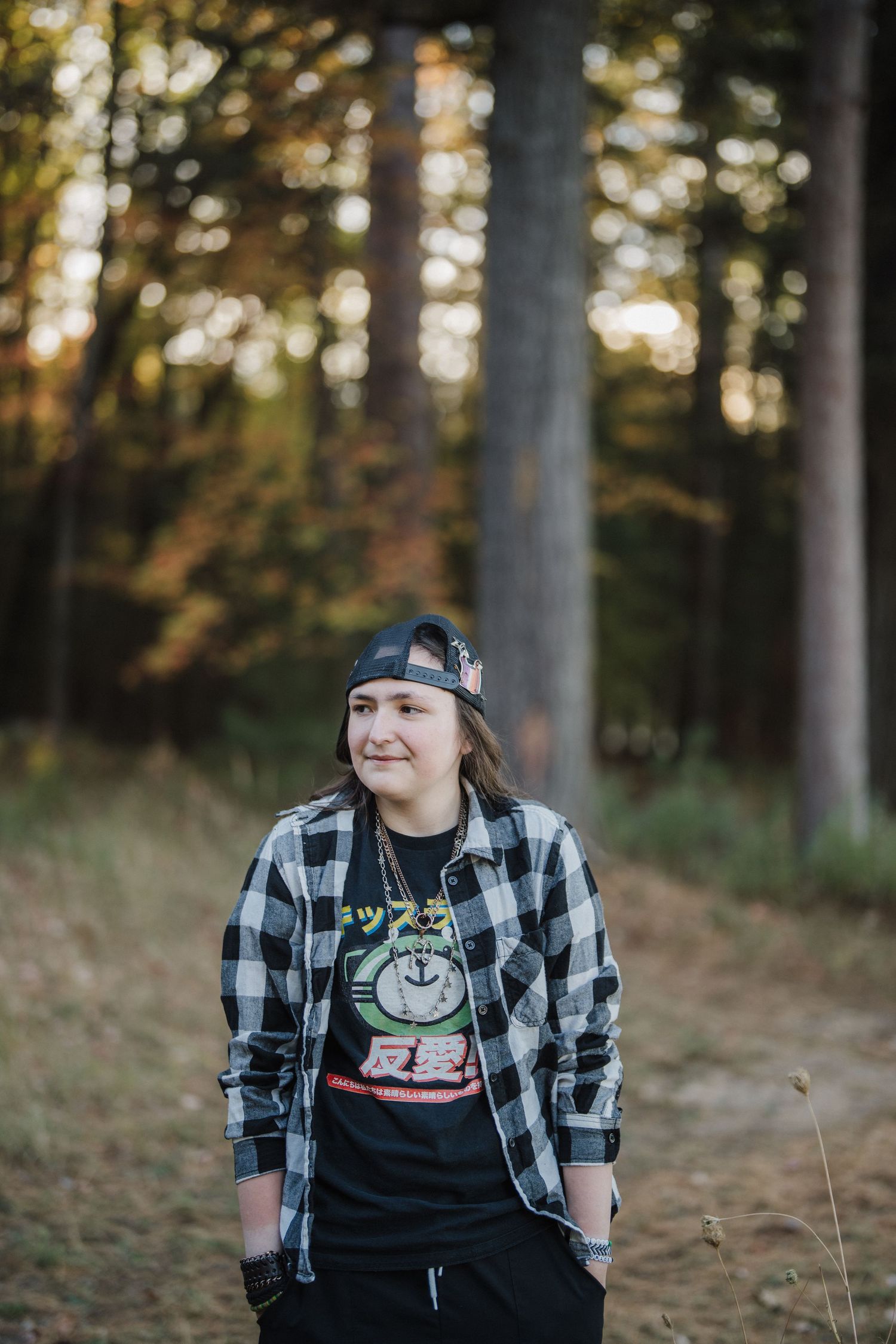 Three photos of someone wearing a plaid flannel shirt and beanie in a forest setting during golden hour.