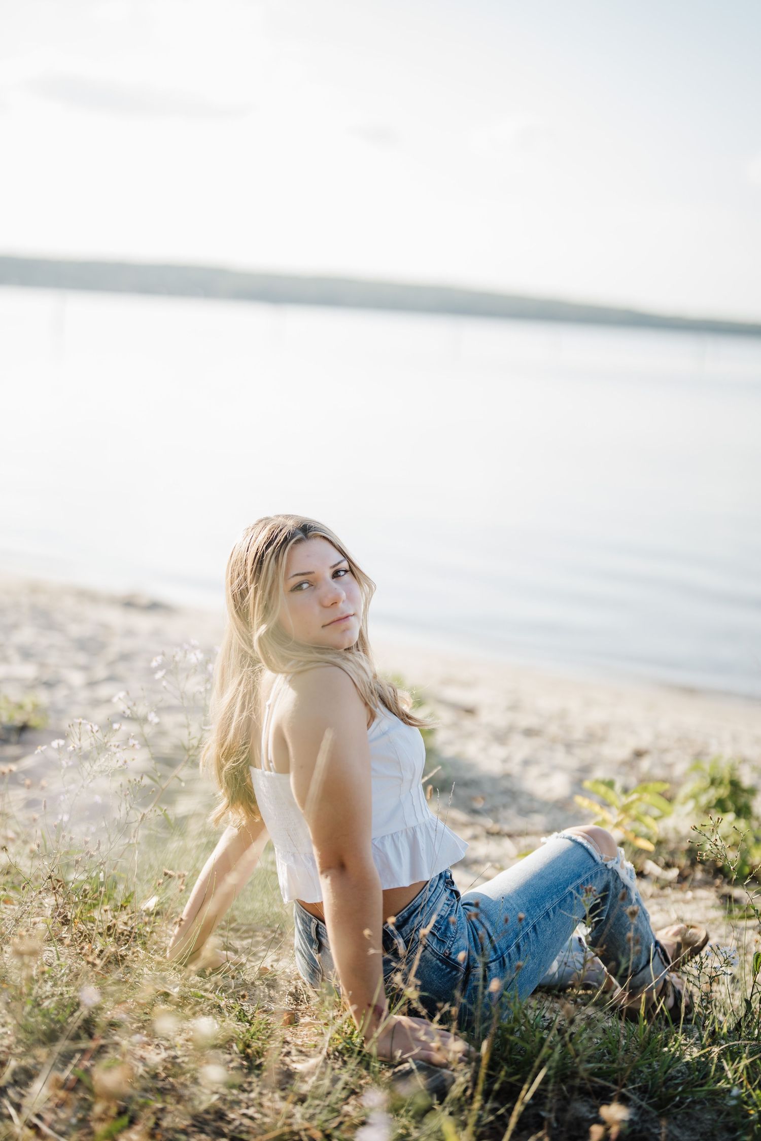 Dreamy seaside portraits captured at golden hour with ocean views in the background.