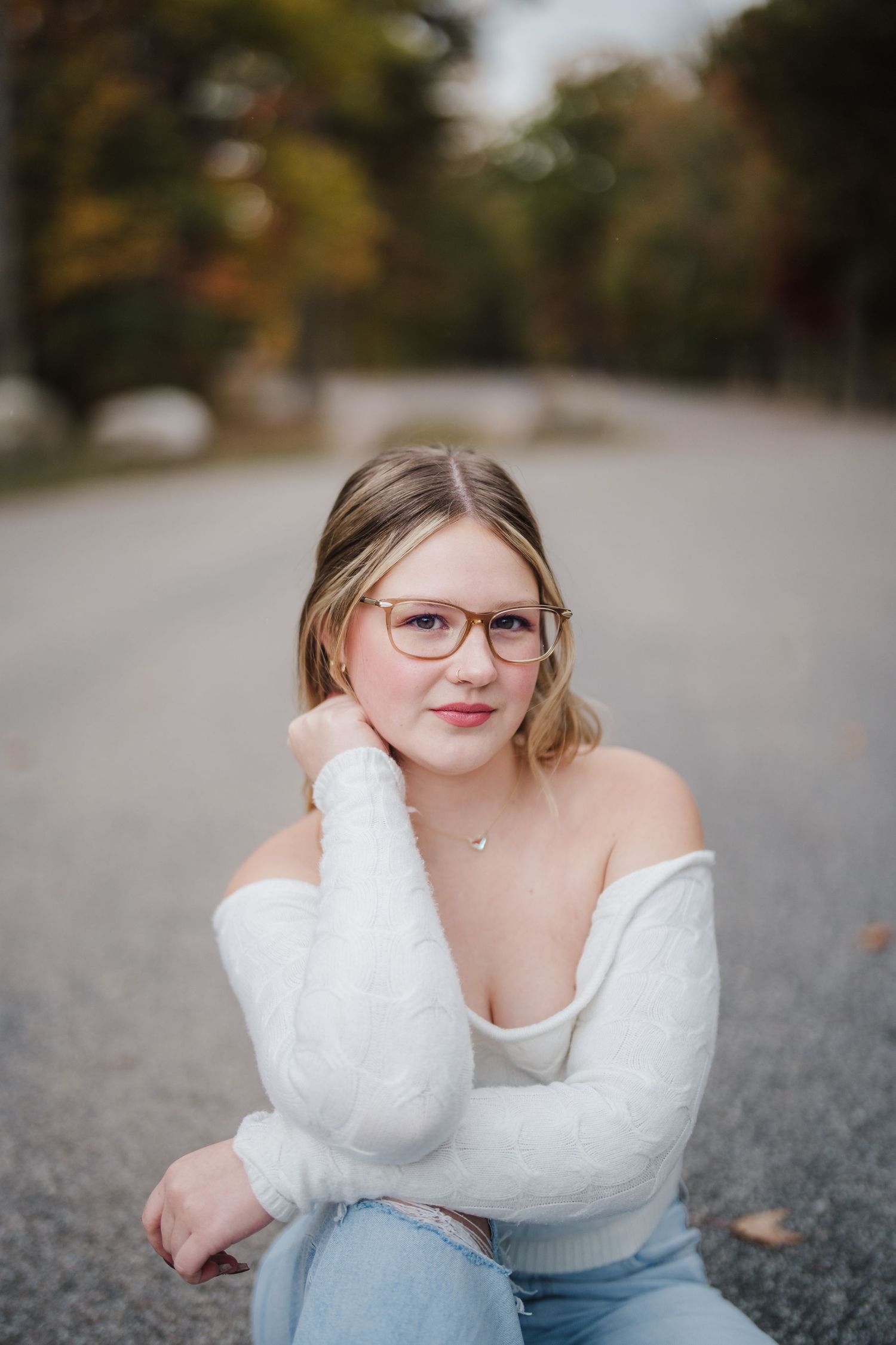 Artistic outdoor portraits with soft focus and autumn colors in the background.
