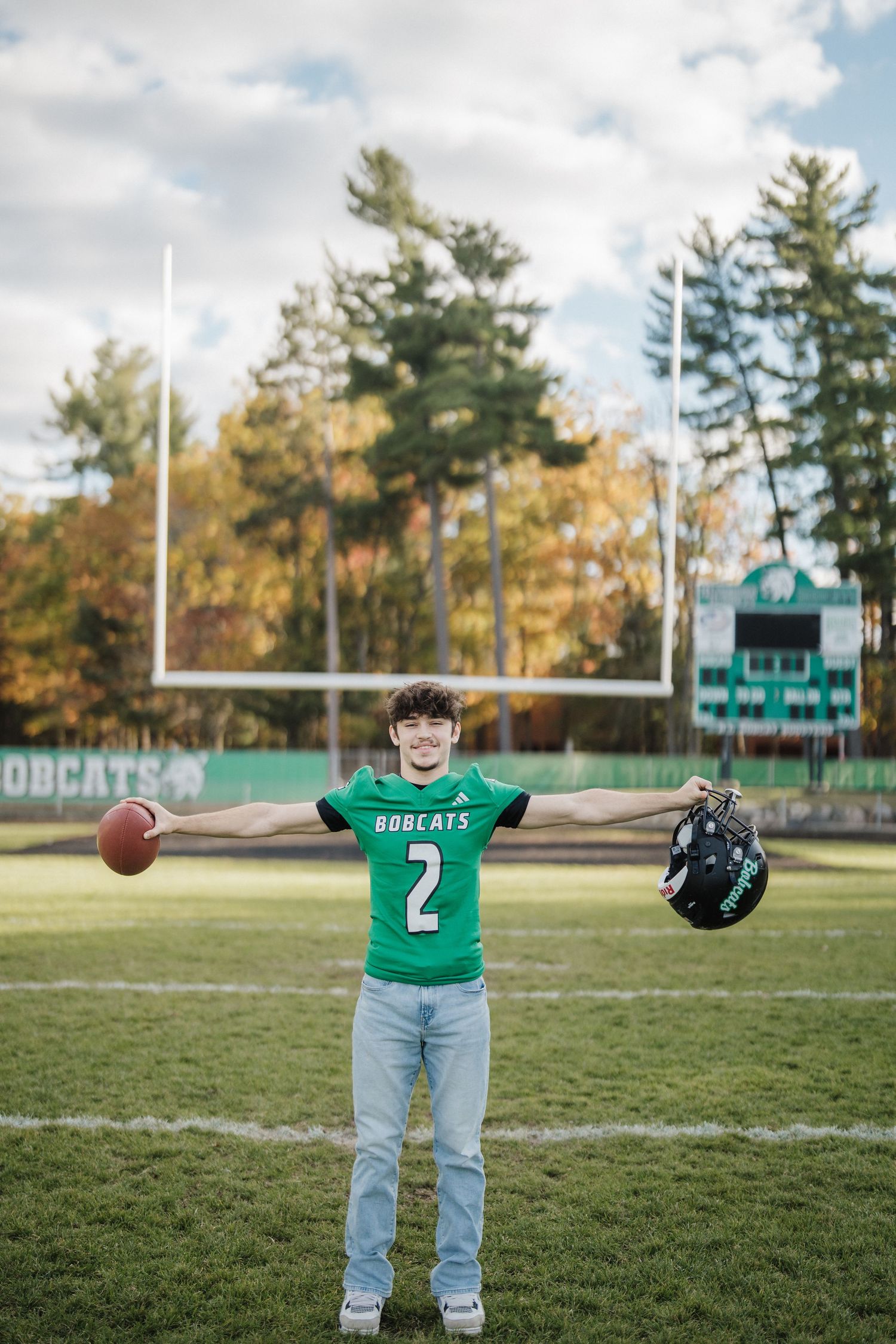 Four sequential photos showing a football being thrown across a field with goal posts and autumn trees.
