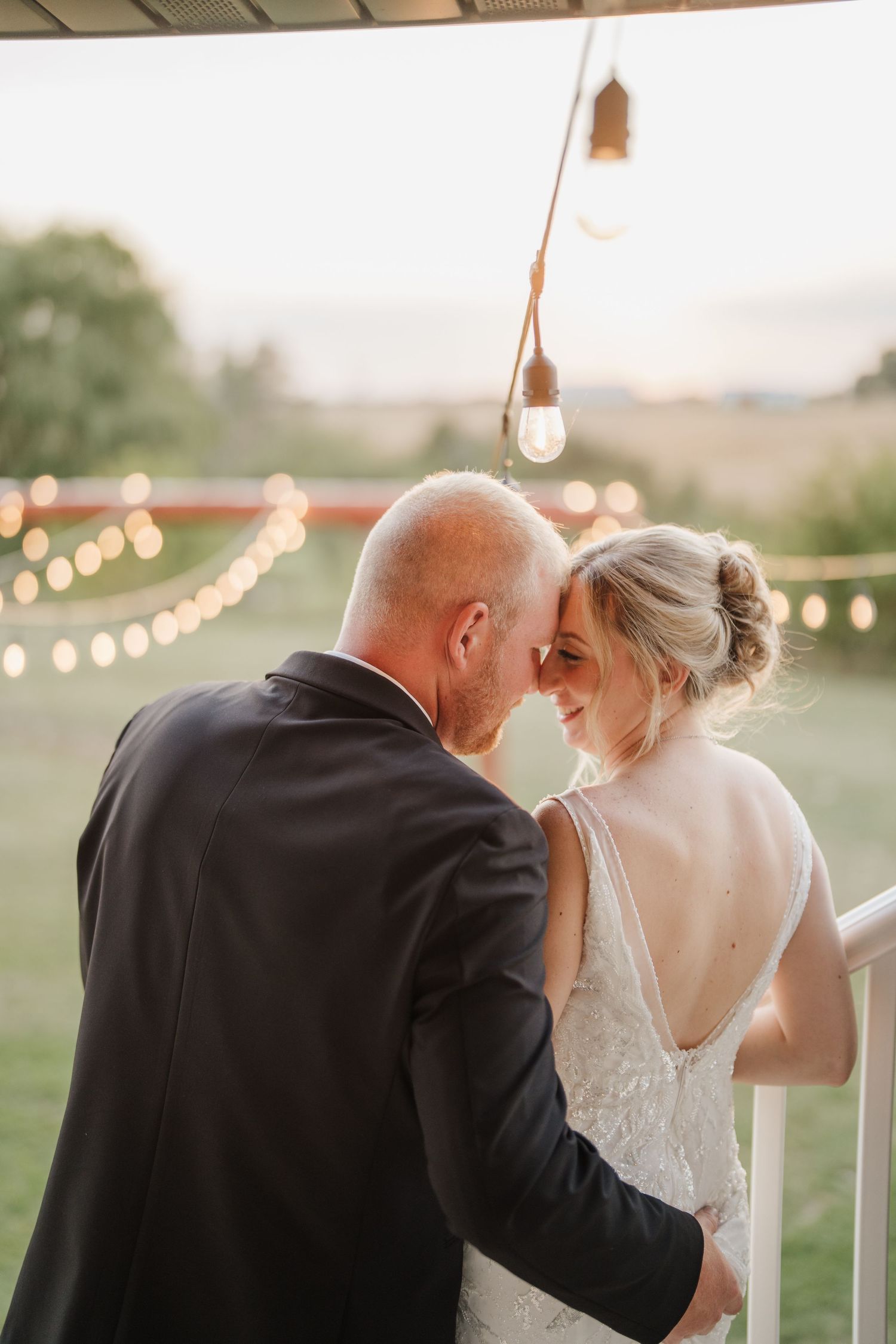 A romantic series of wedding photos showing tender moments between a couple during golden hour with string lights in background.