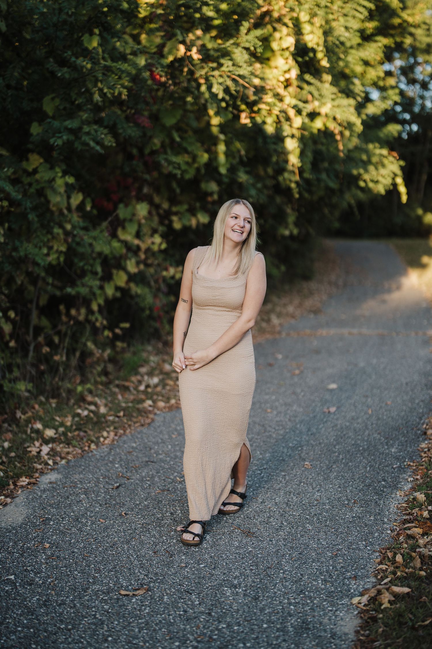 A series of outdoor portrait shots on a gravel path surrounded by lush greenery in warm sunlight.