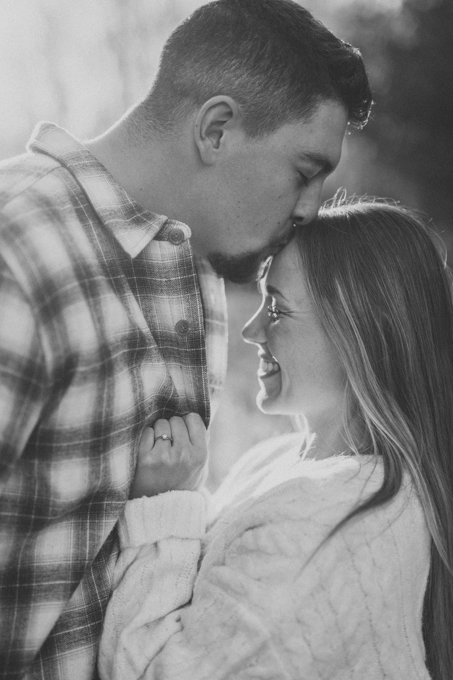 Black and white close-up photos showing tender romantic moments in a natural setting.