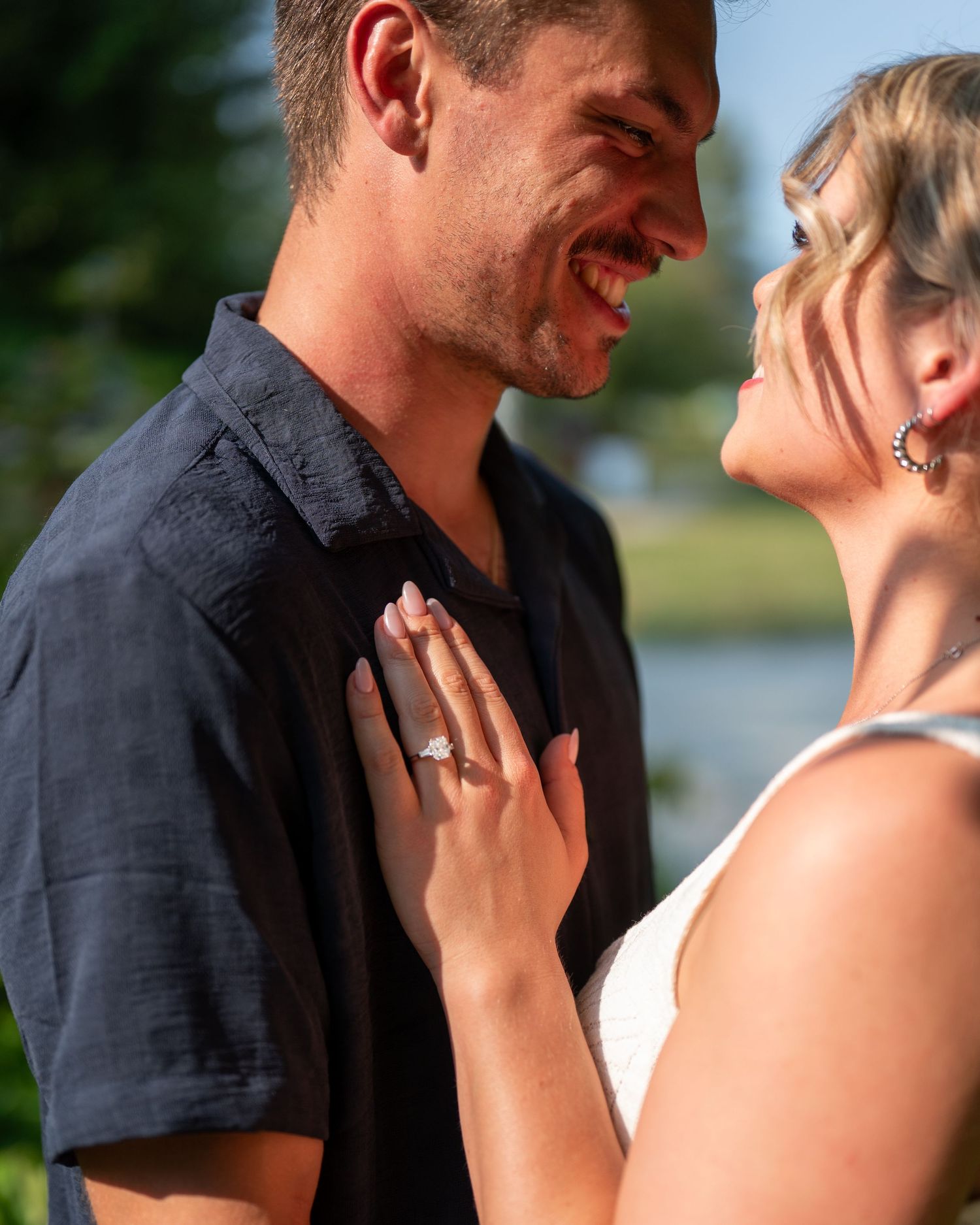 Close-up shots of a tender romantic moment between two people outdoors.