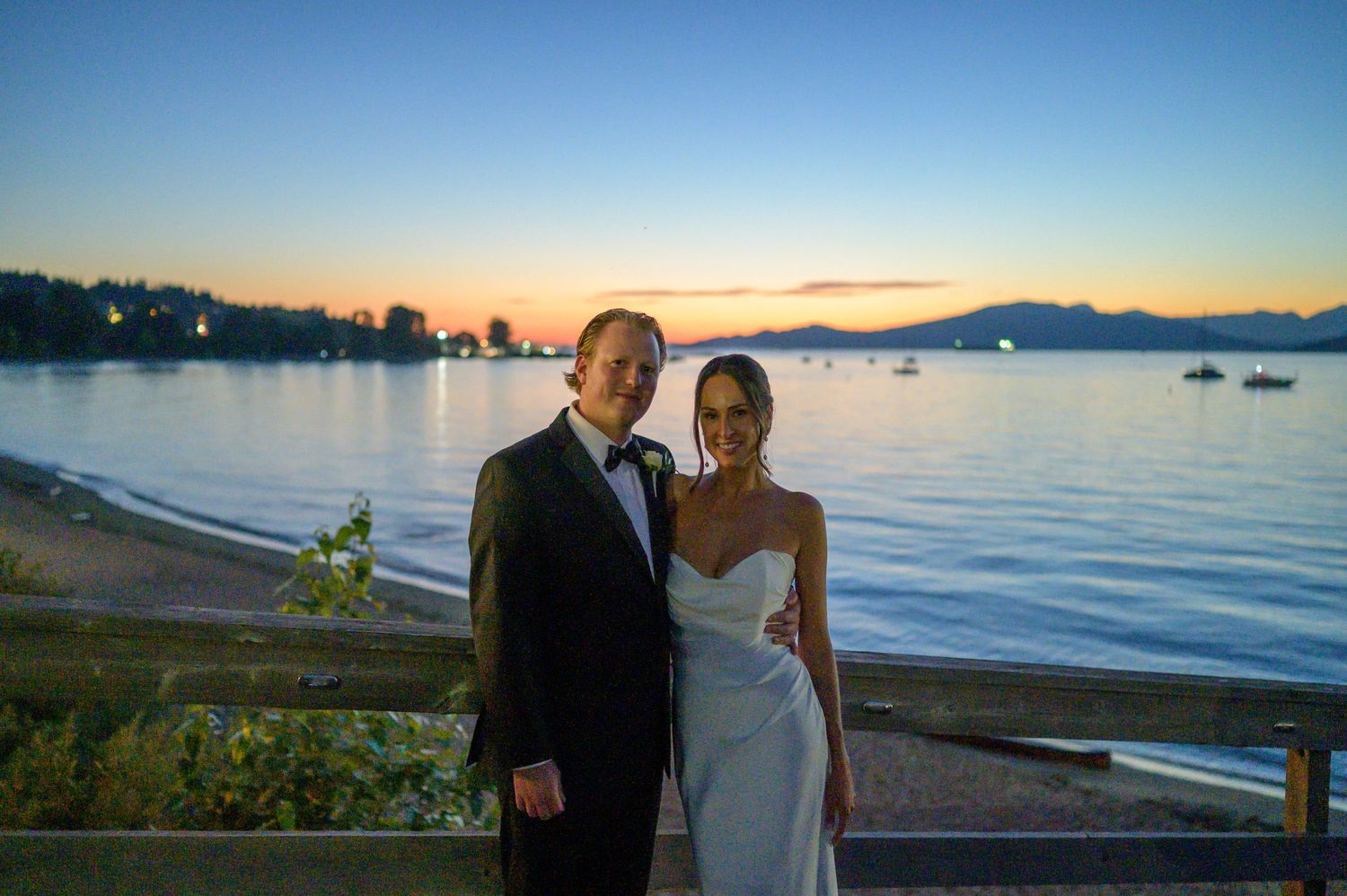 Sunset wedding photos with scenic ocean and mountain views.