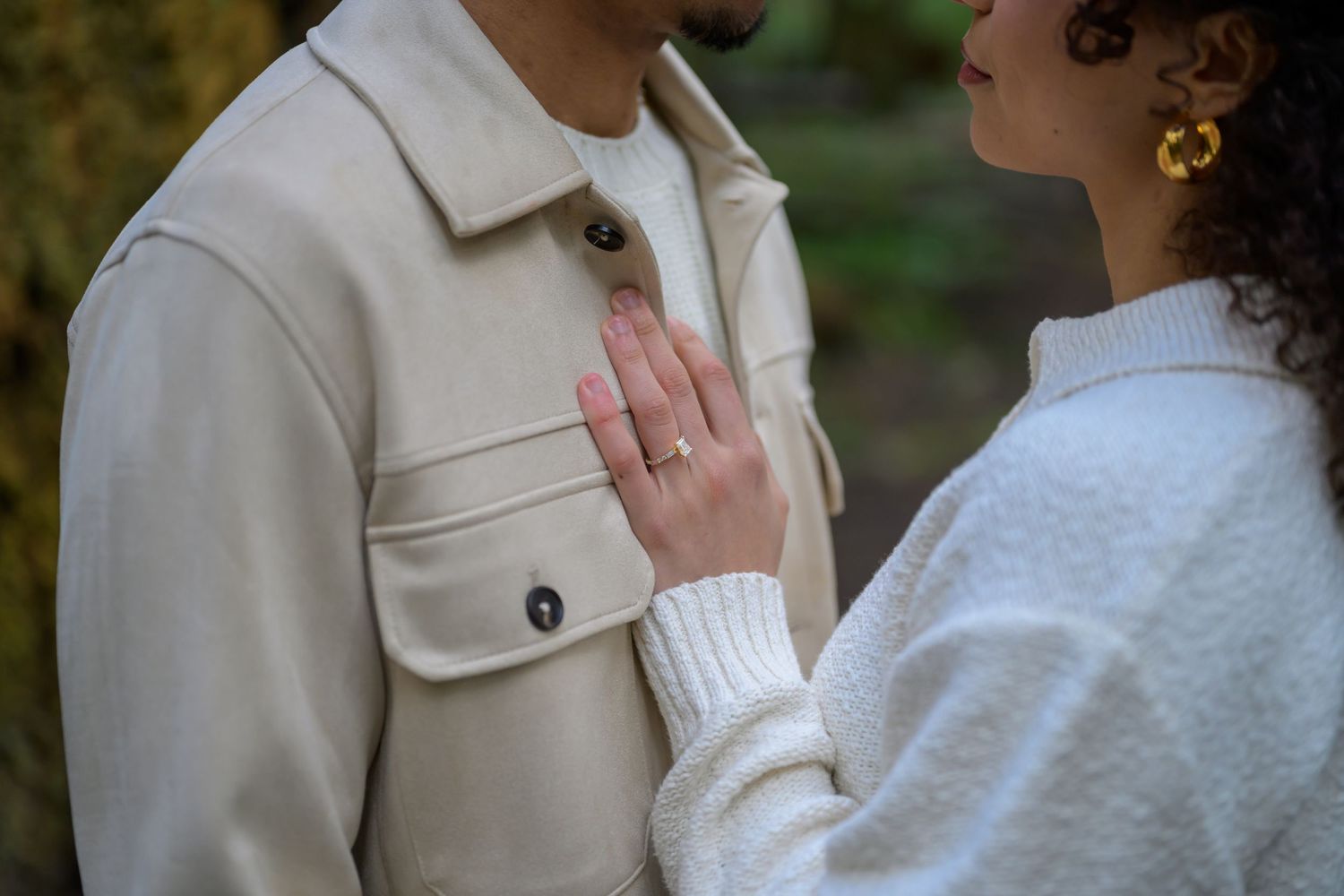 Romantic couple shares intimate moments in a series of close-up shots wearing white and cream colored outfits.