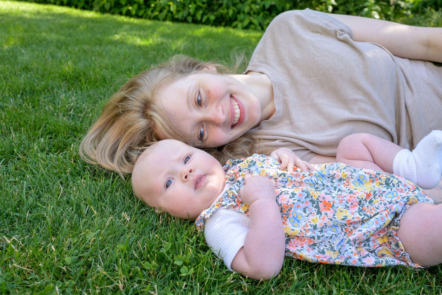 A sequence of playful moments captured on a sunny lawn with green trees in the background.