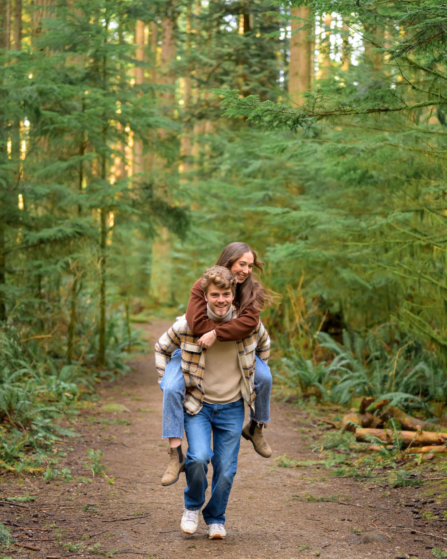 Playful interaction between people on wooded forest path.