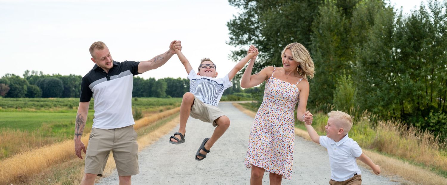 Joyful family playtime captured in series of outdoor photos along a nature path.