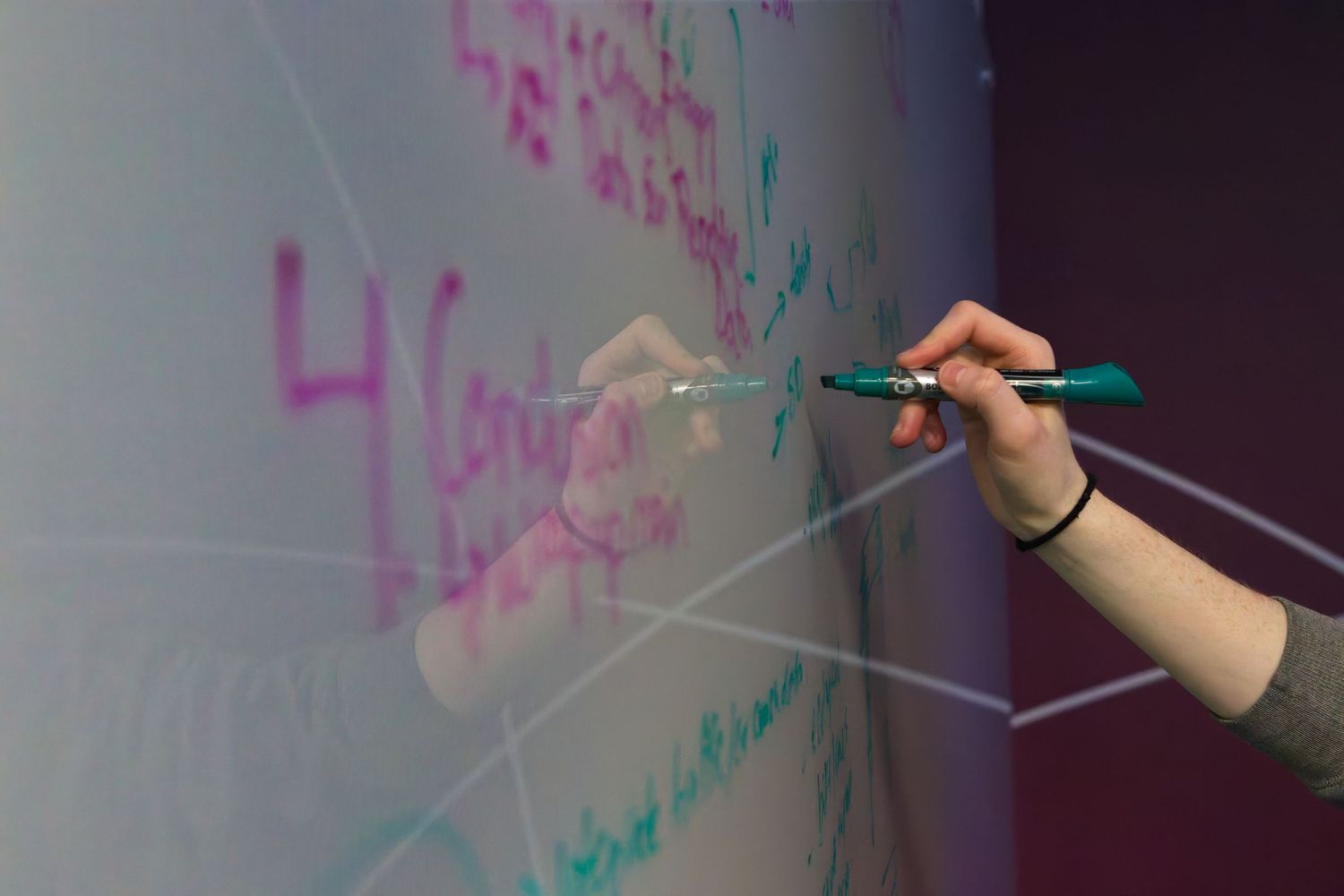 Someone writing on a whiteboard