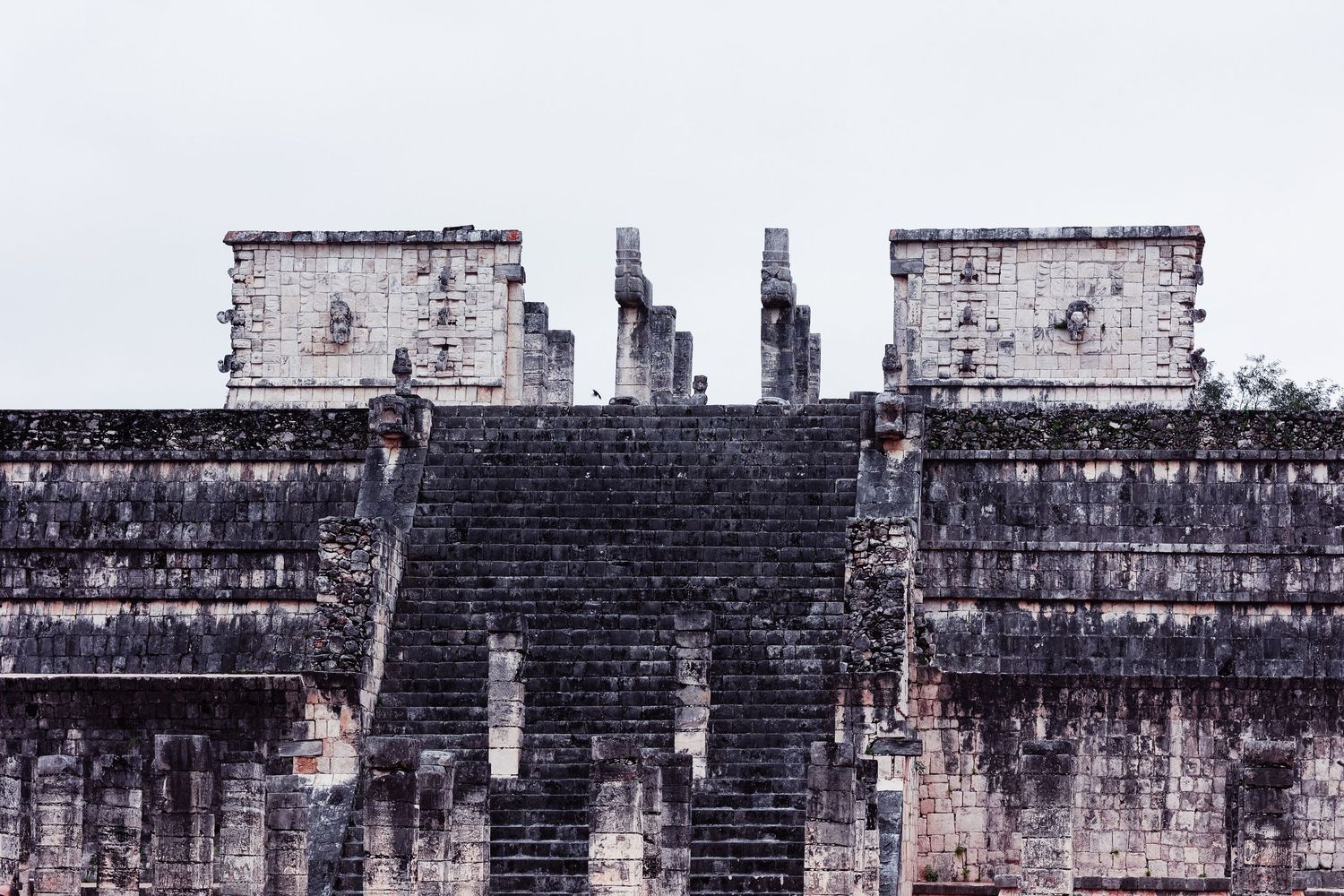Ancient Mayan Temple of Warriors ruins with stone columns at Chichen Itza, Mexico.
