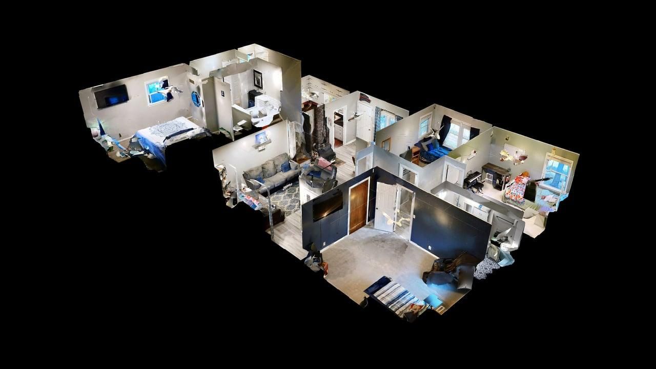 3D dollhouse view of a multi-level residential property showing room layouts and spatial relationships.