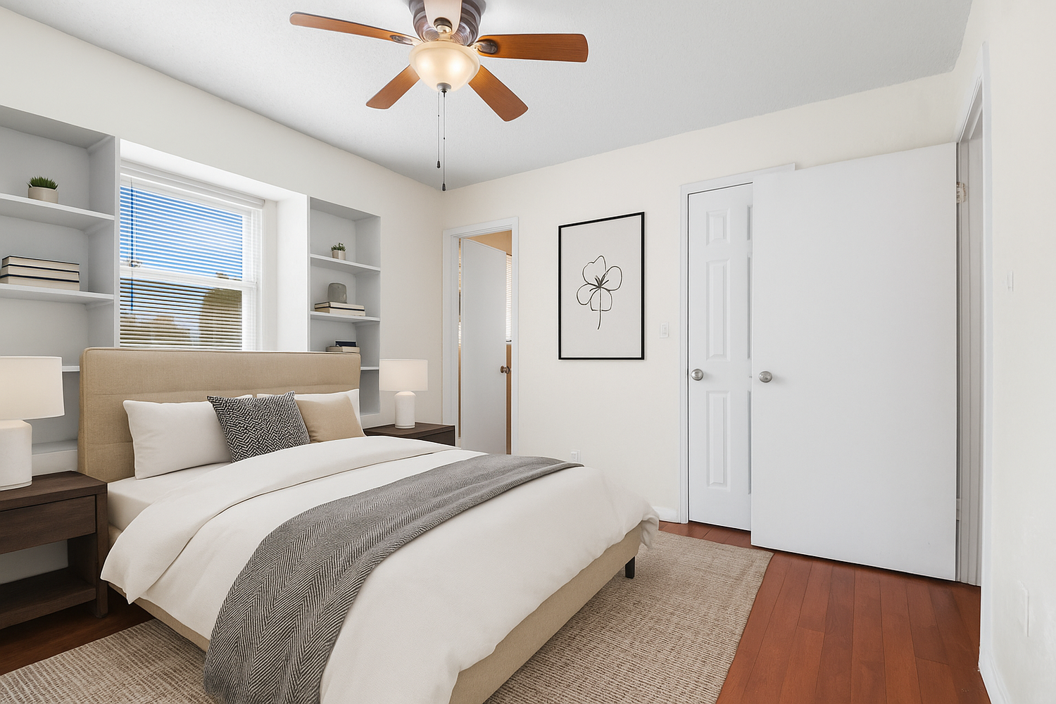 Bright bedroom featuring ceiling fan, hardwood floors, and built-in storage solutions.